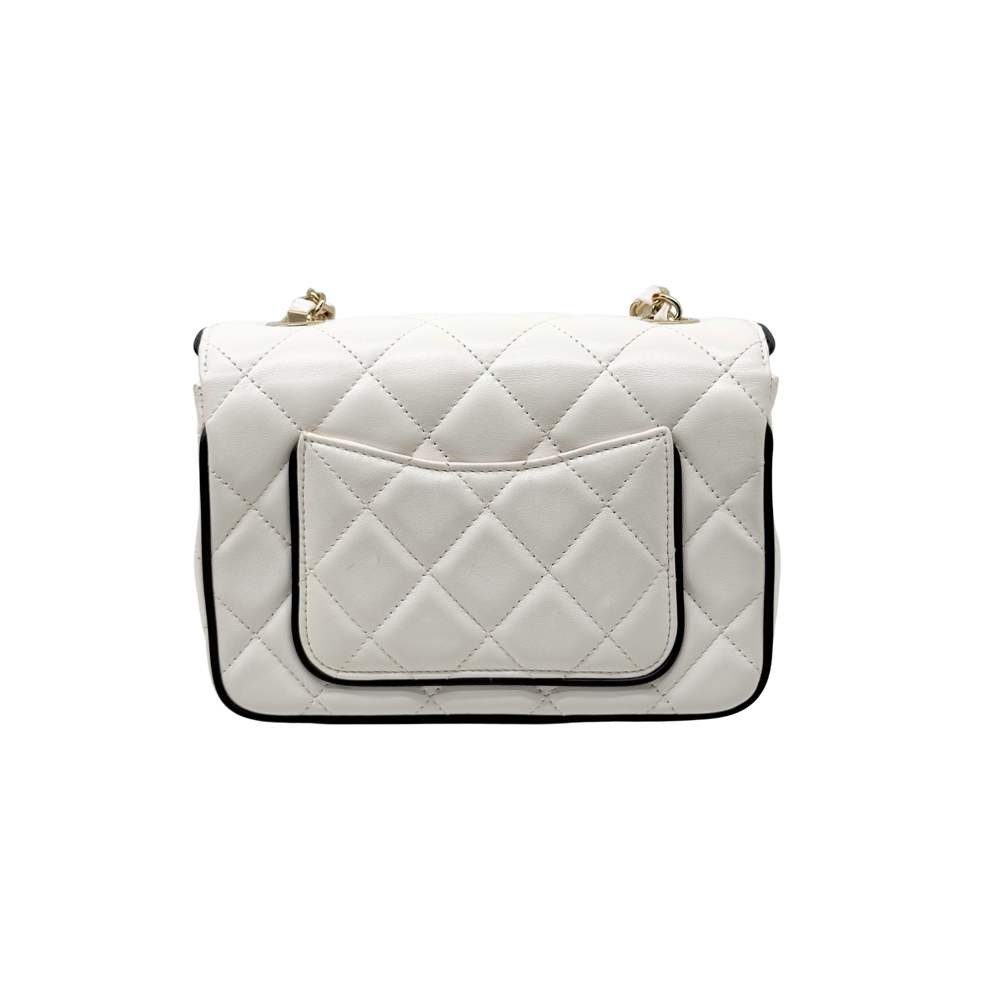 Pre-owned quilted shoulder bag with front flap, gold chain strap, and turn-lock