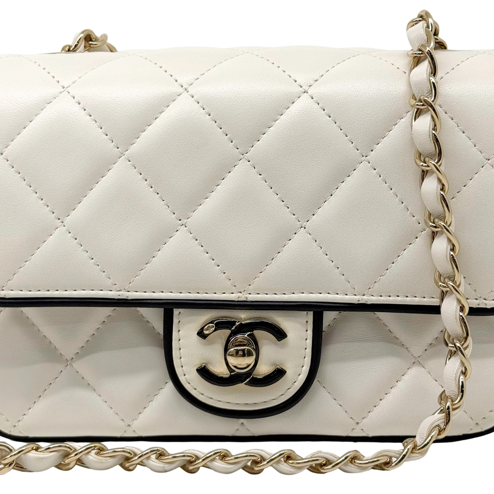 Pre-owned quilted shoulder bag front close-up with CC logo plaque and gold chain