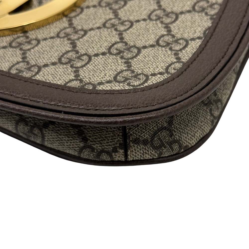 Gucci GG canvas bag corner with brown leather edge trim and stitched border
