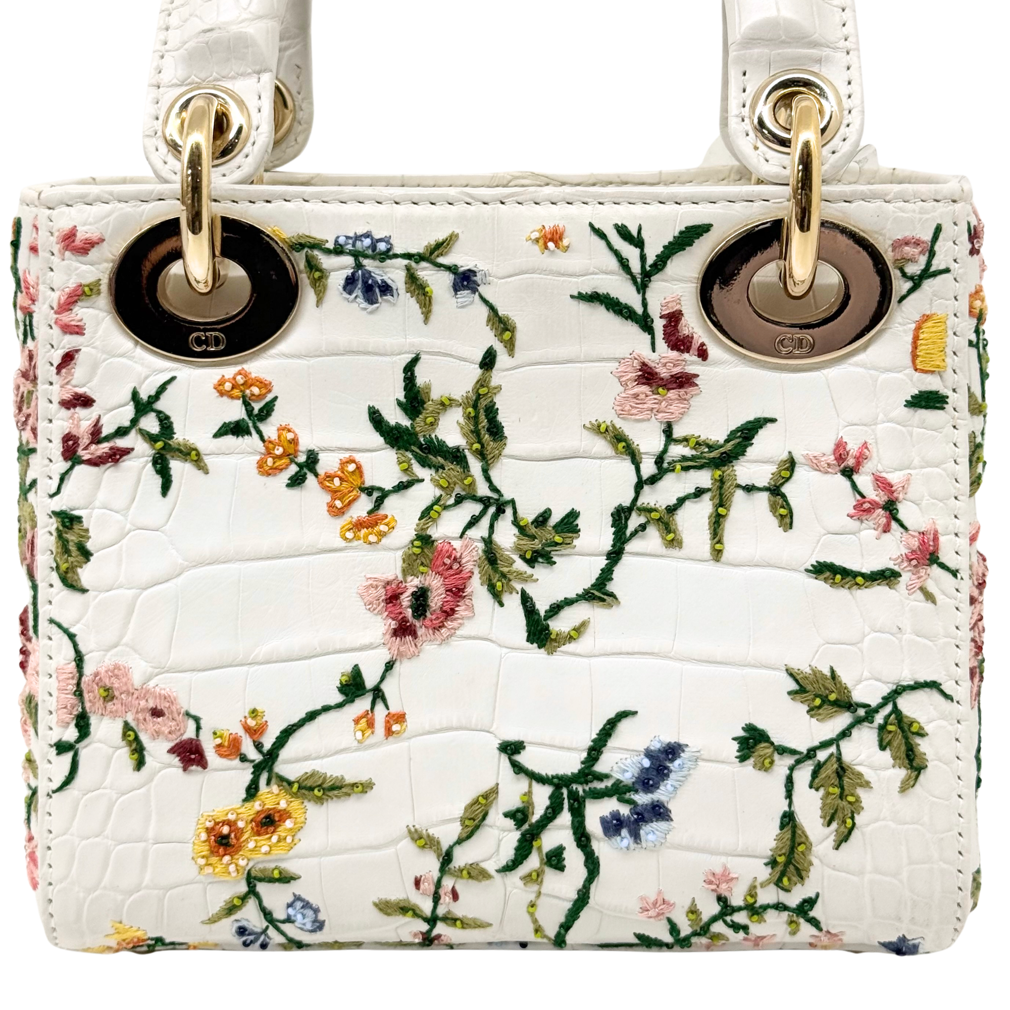 White floral mini handbag front with gold top rings and CD logo plaques