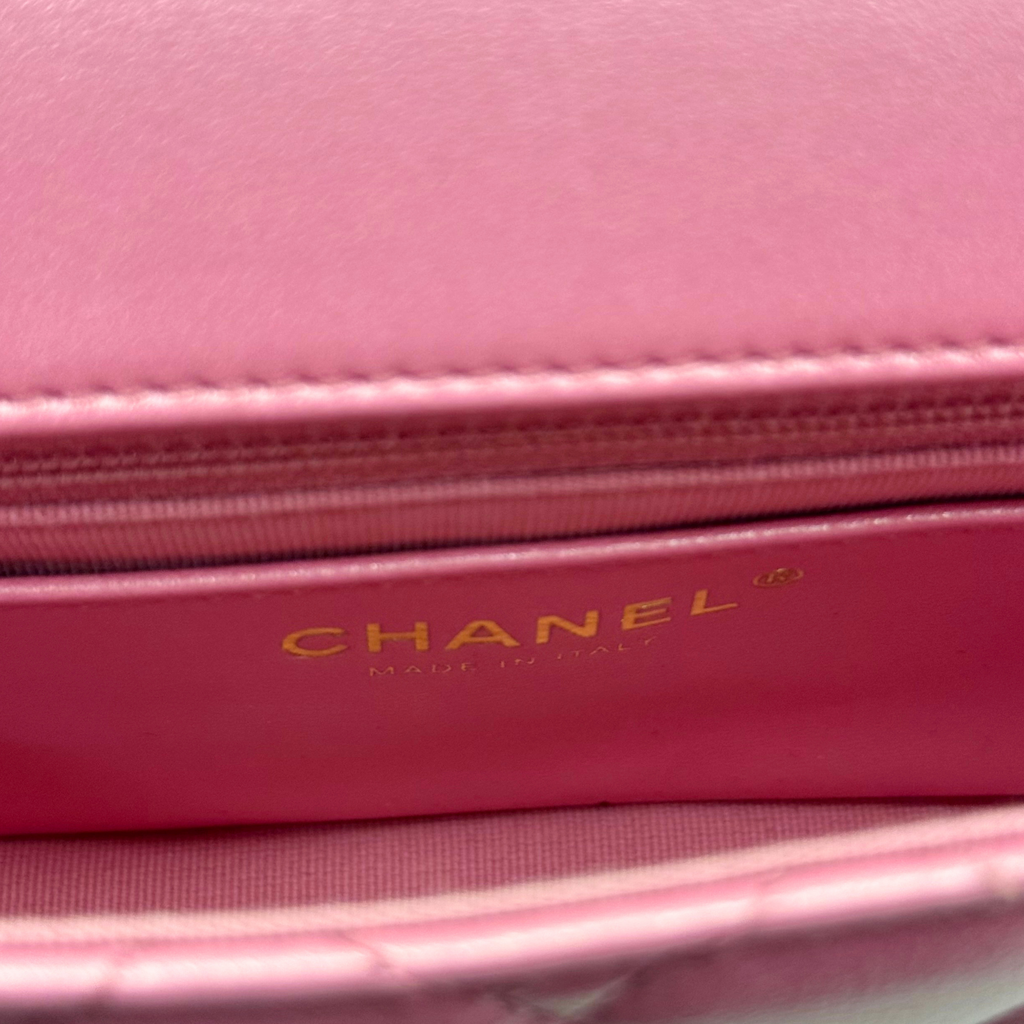 CHANEL logo plate on pink interior flap of quilted mini bag