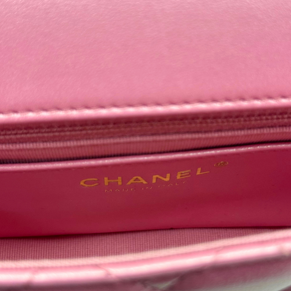 CHANEL logo plate on pink interior flap of quilted mini bag