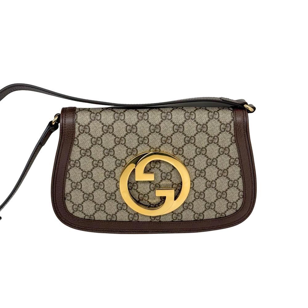 Gucci GG canvas crossbody bag with gold double-G front logo and brown strap