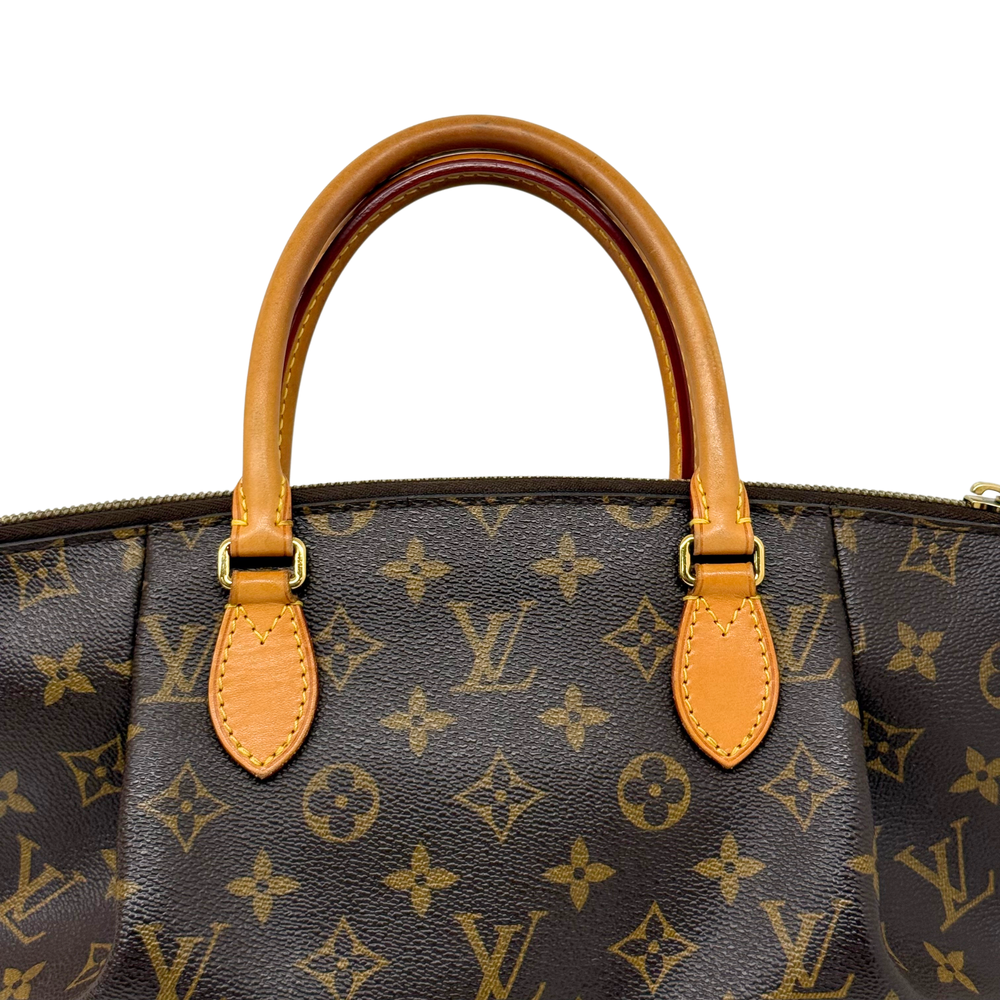 Louis Vuitton monogram tote with tan leather handles and zip top