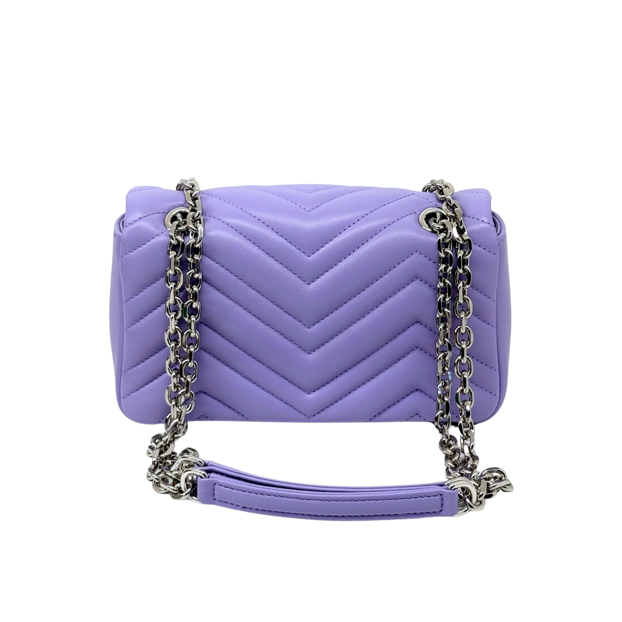 Lavender quilted mini shoulder bag with chevron stitching and silver chain crossbody strap