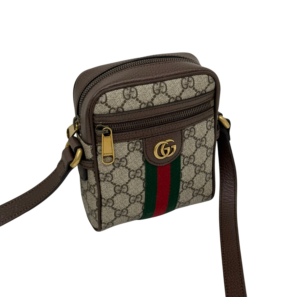 Gucci GG canvas crossbody bag front with green and red web stripe, zip pocket and leather strap