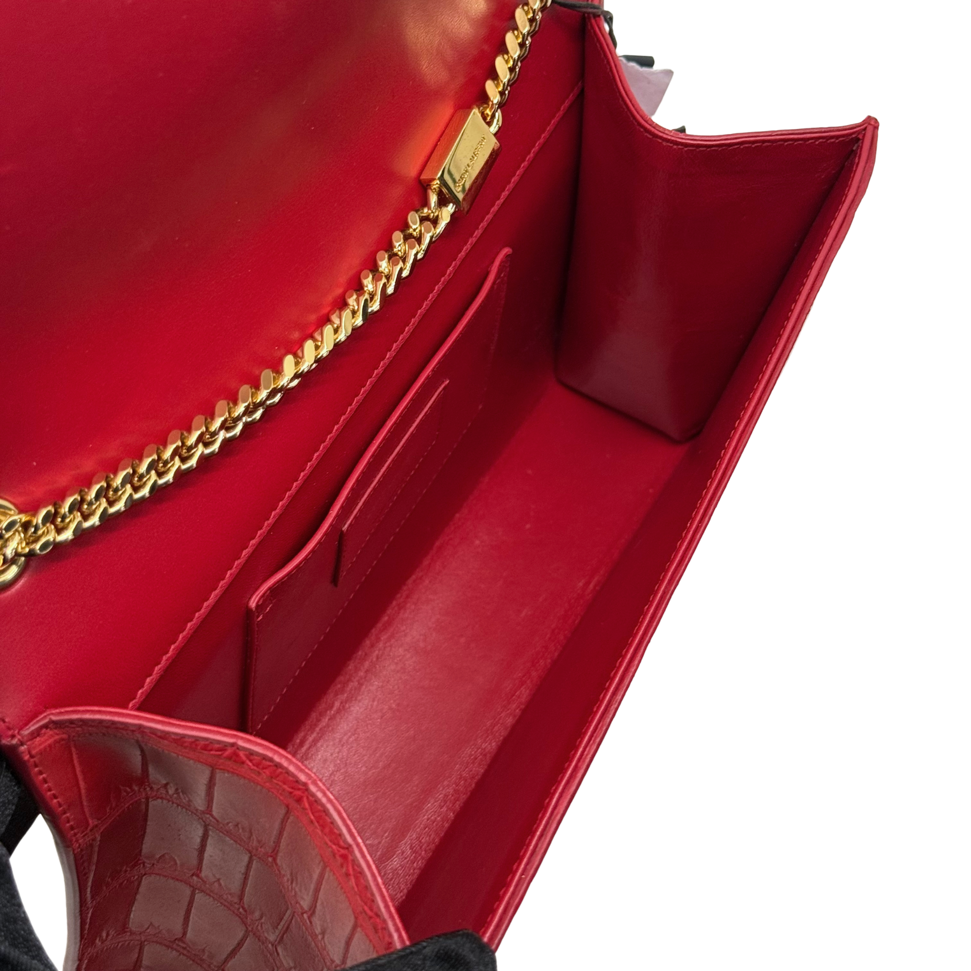 Red leather flap clutch interior with gold chain and stitched panel detail