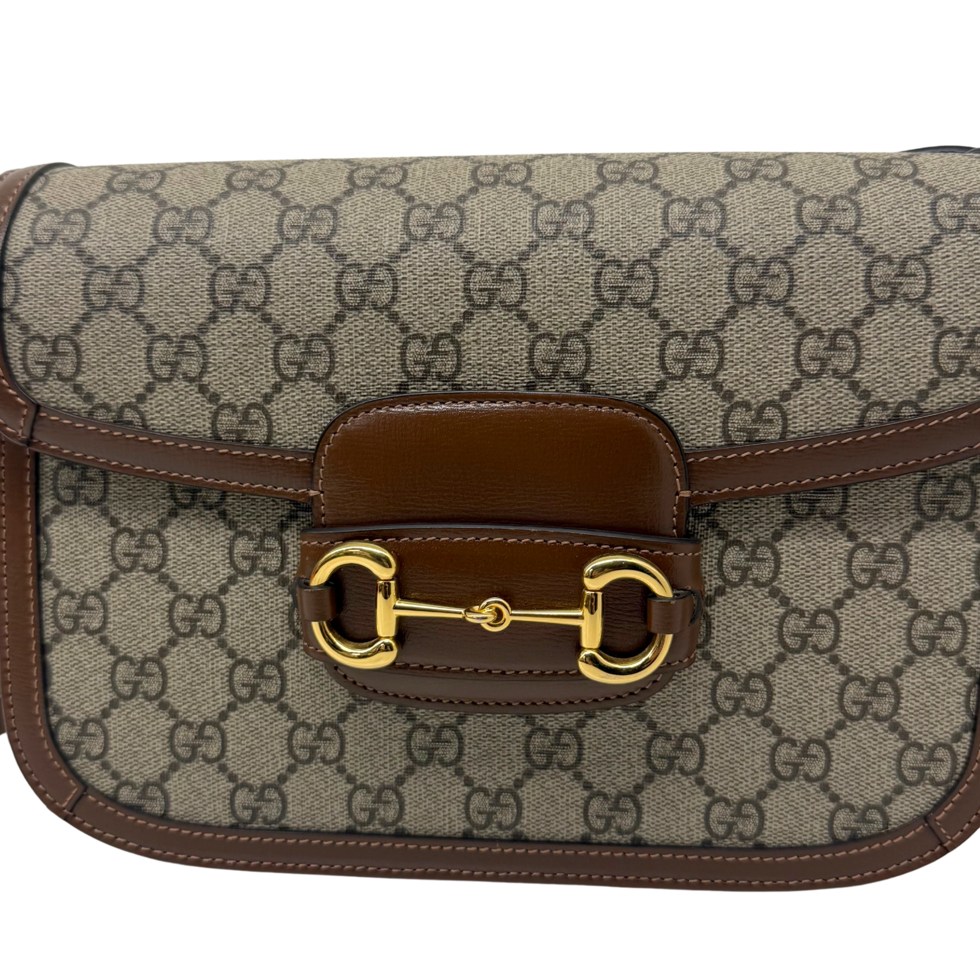 Pre-owned Gucci bag front flap with monogram canvas, brown center panel, gold clasp
