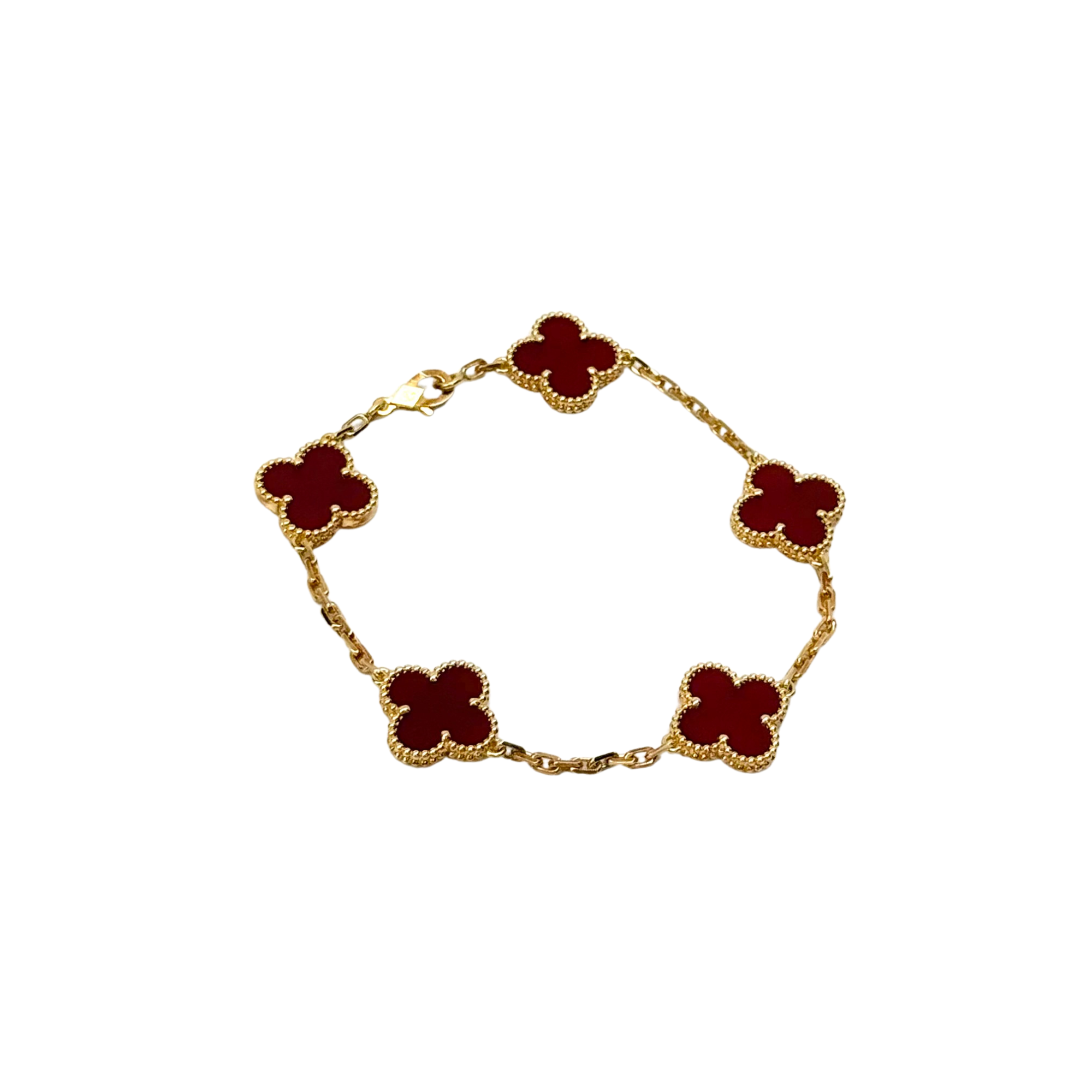 Gold bracelet with red quatrefoil charms on chain, centered view
