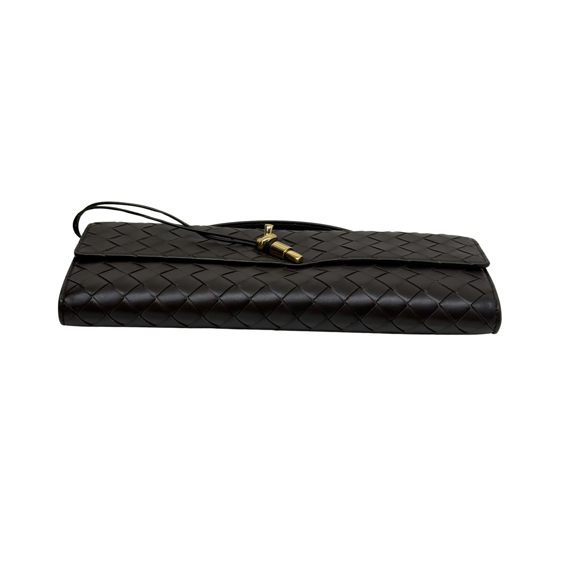 Black woven leather flap bag with top handle and gold clasp