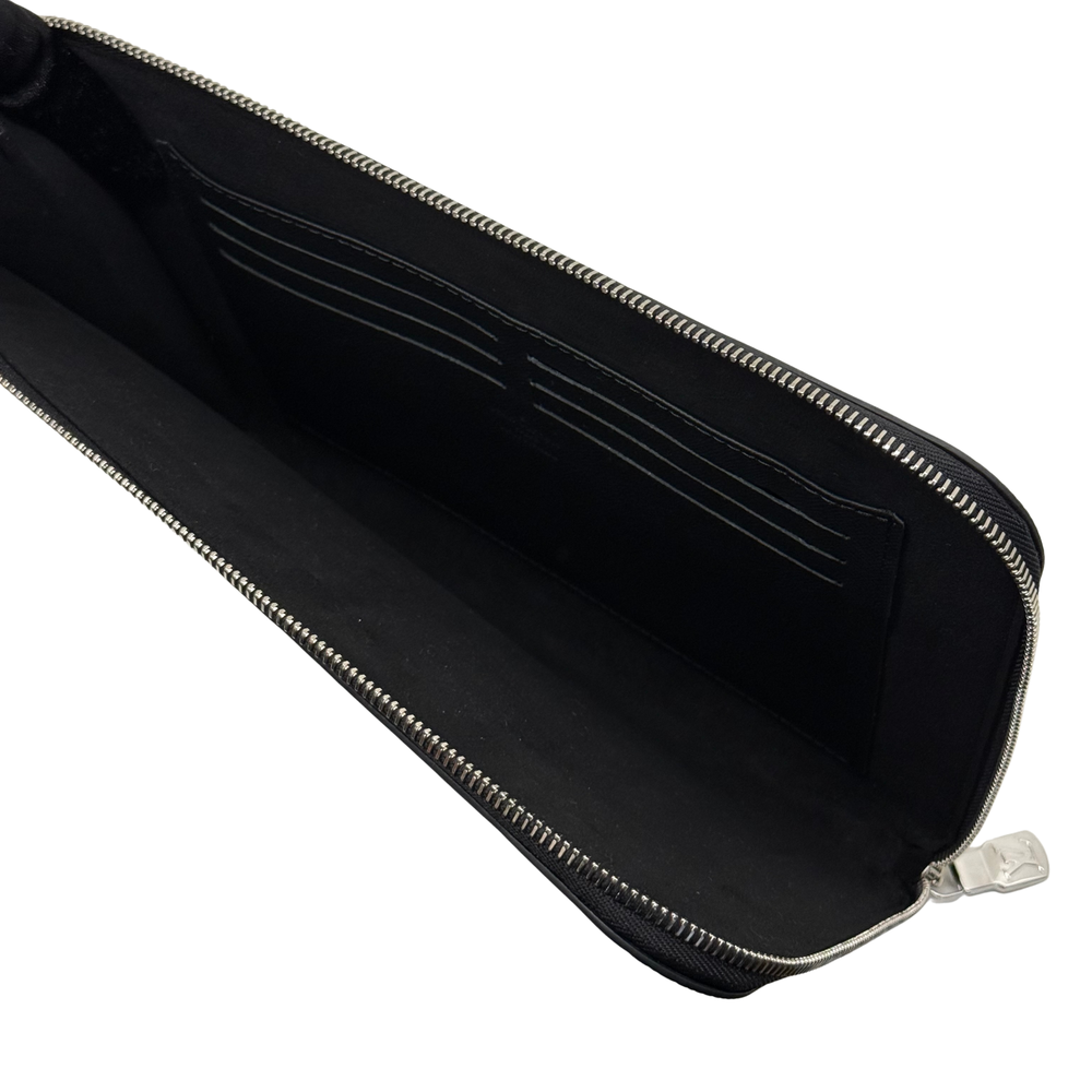 Louis Vuitton black leather wallet interior with zip opening and card slot lining