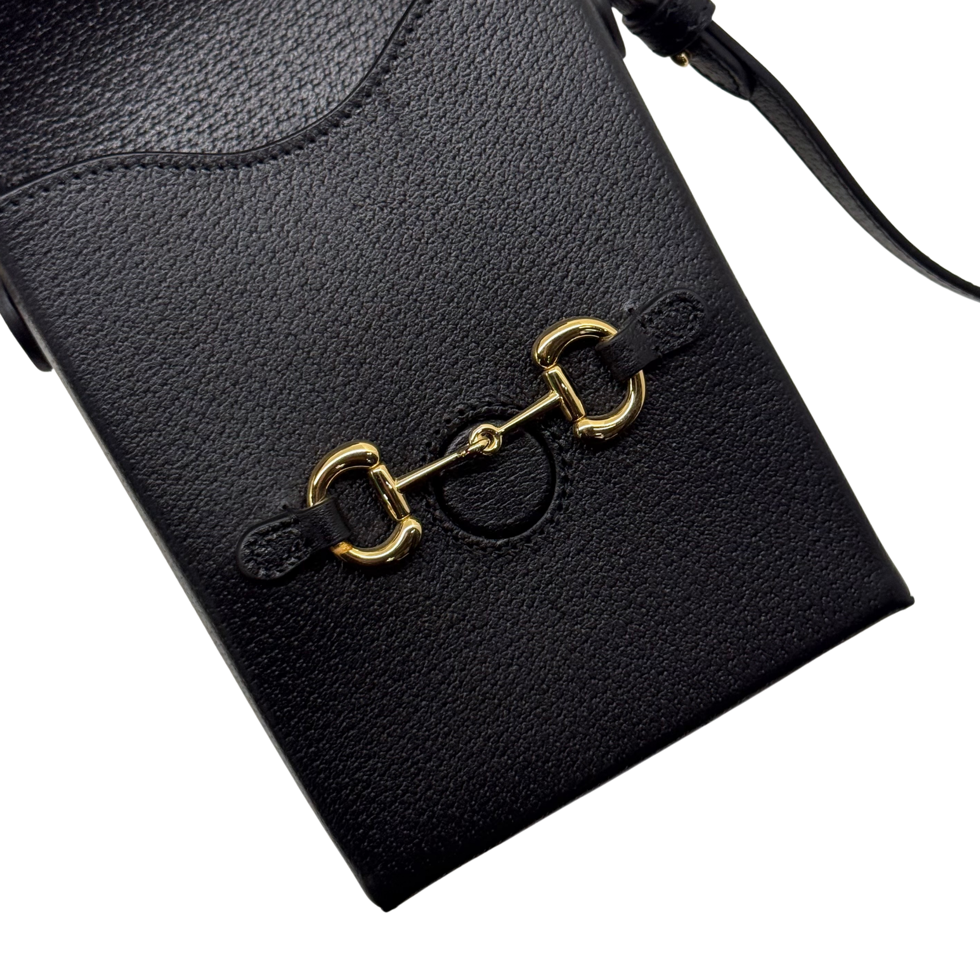 Gucci black leather mini crossbody bag with gold clasp and embossed logo front