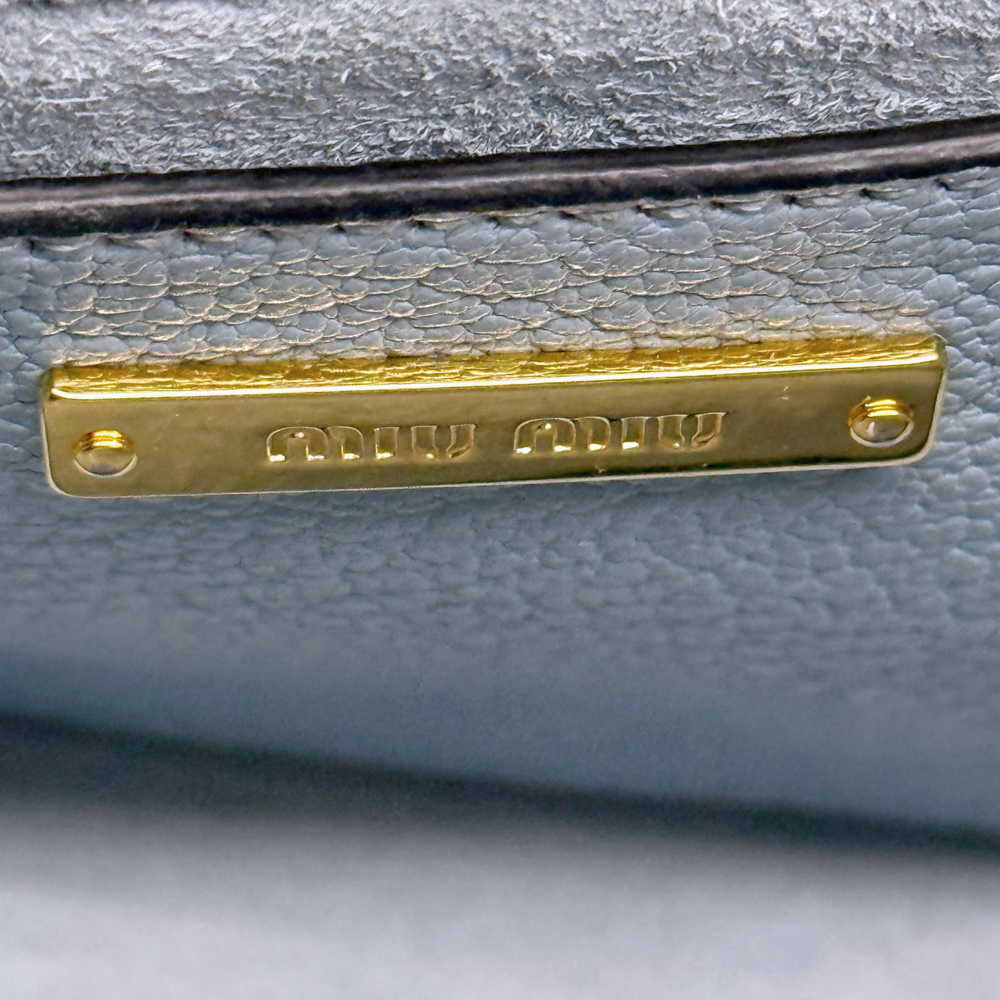 Pre-owned Miu Miu bag hardware logo plate, gold on light blue