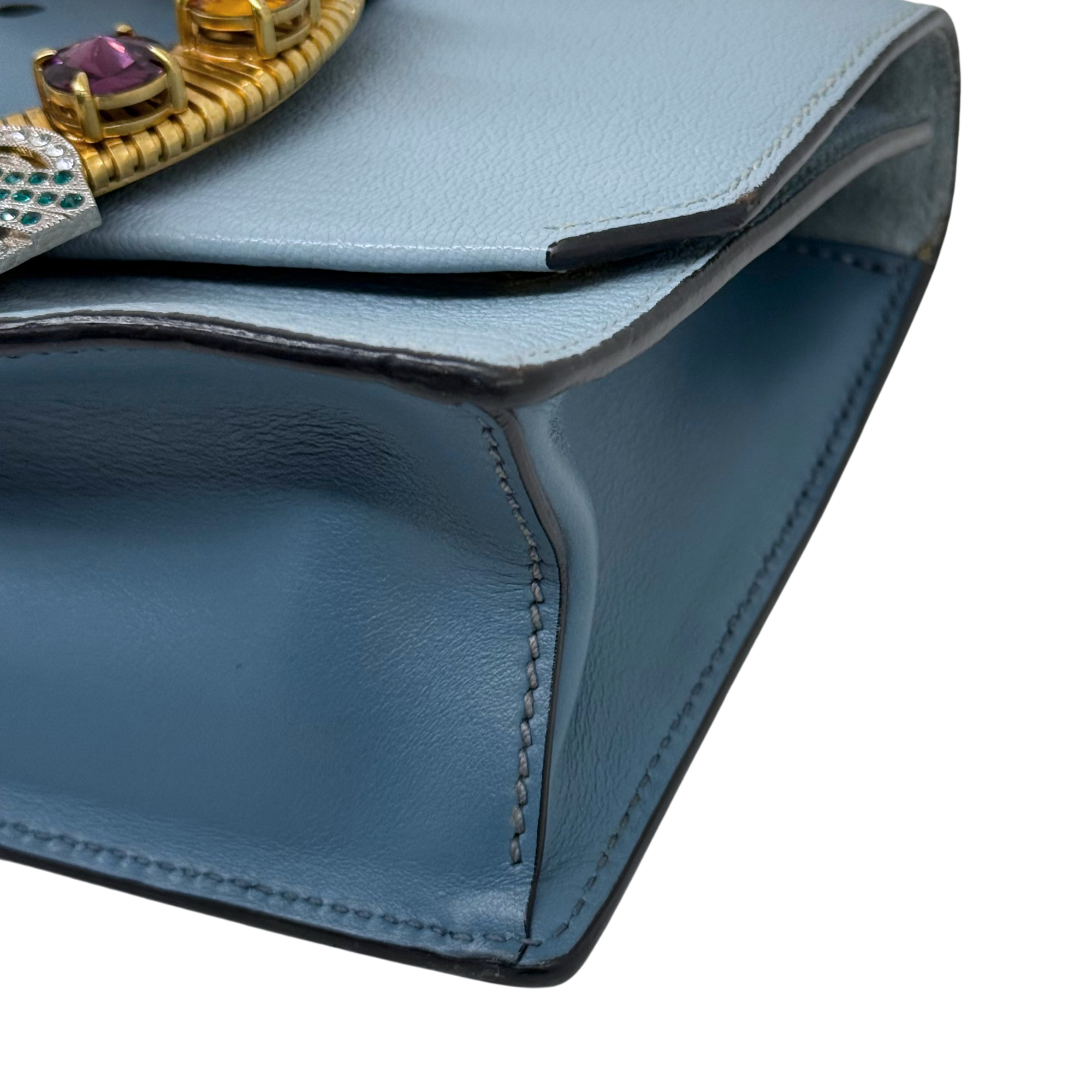 Pre-owned Miu Miu light blue bag corner with stitched seams and gold-toned trim