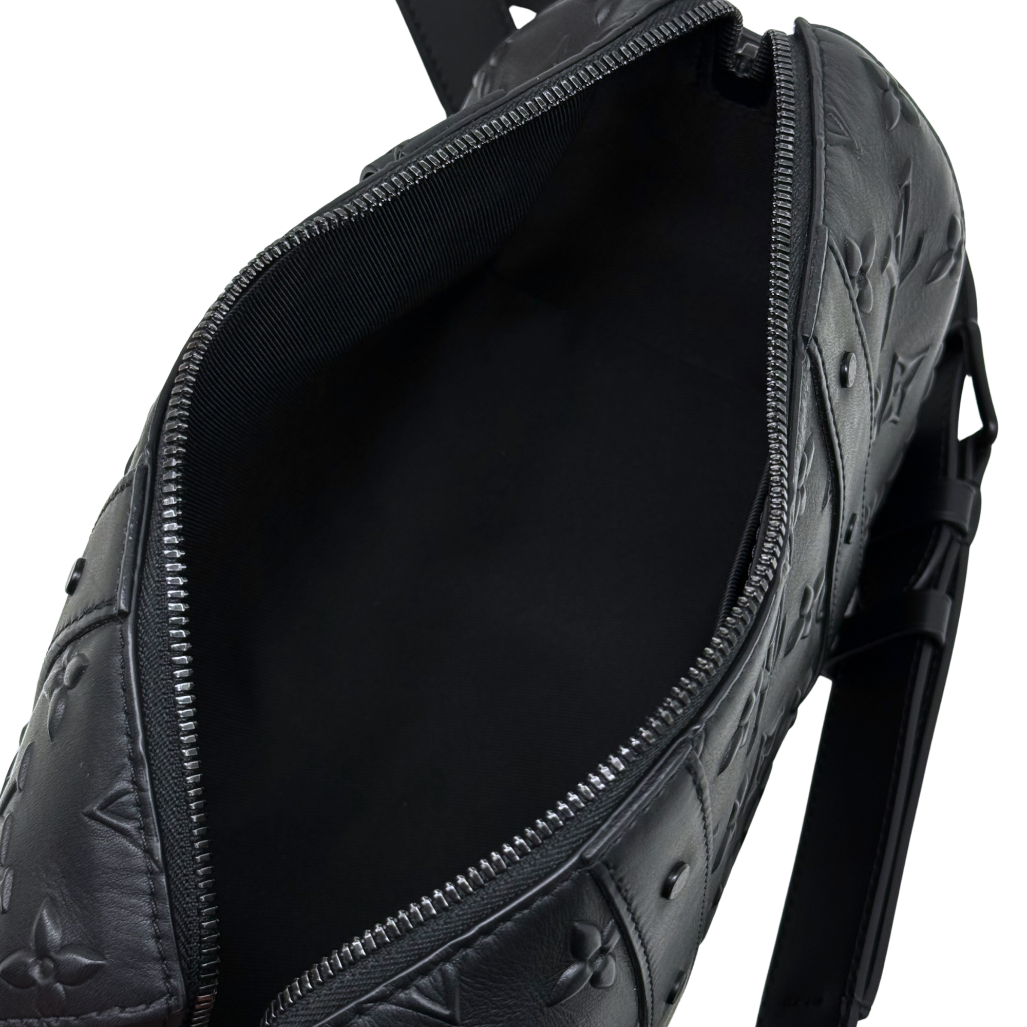 Black Louis Vuitton monogram bag with open zipper compartment and dark lining