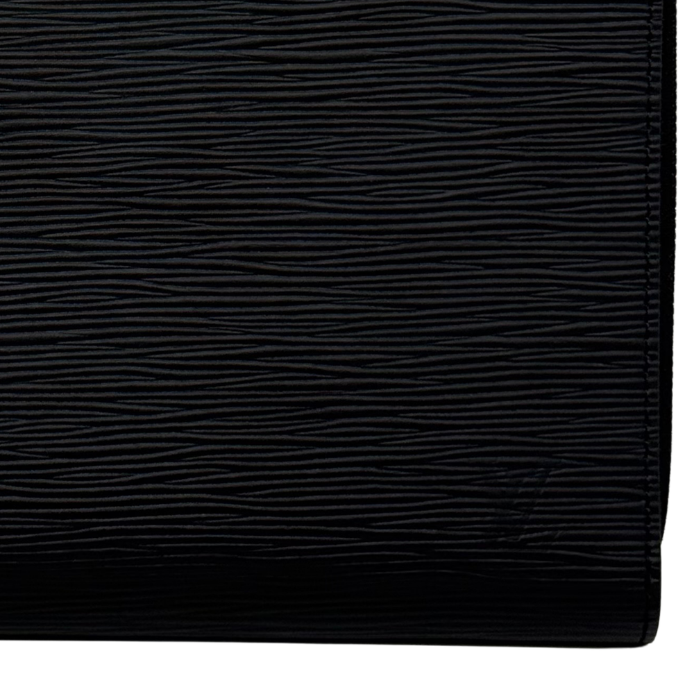 Louis Vuitton black leather wallet close-up showing textured grain and stitched trim