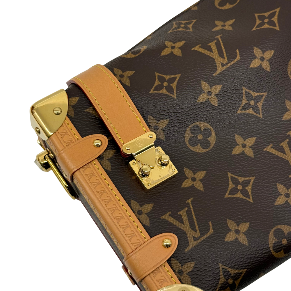 Louis Vuitton monogram handbag with tan handle strap, gold-tone hardware, brown pattern