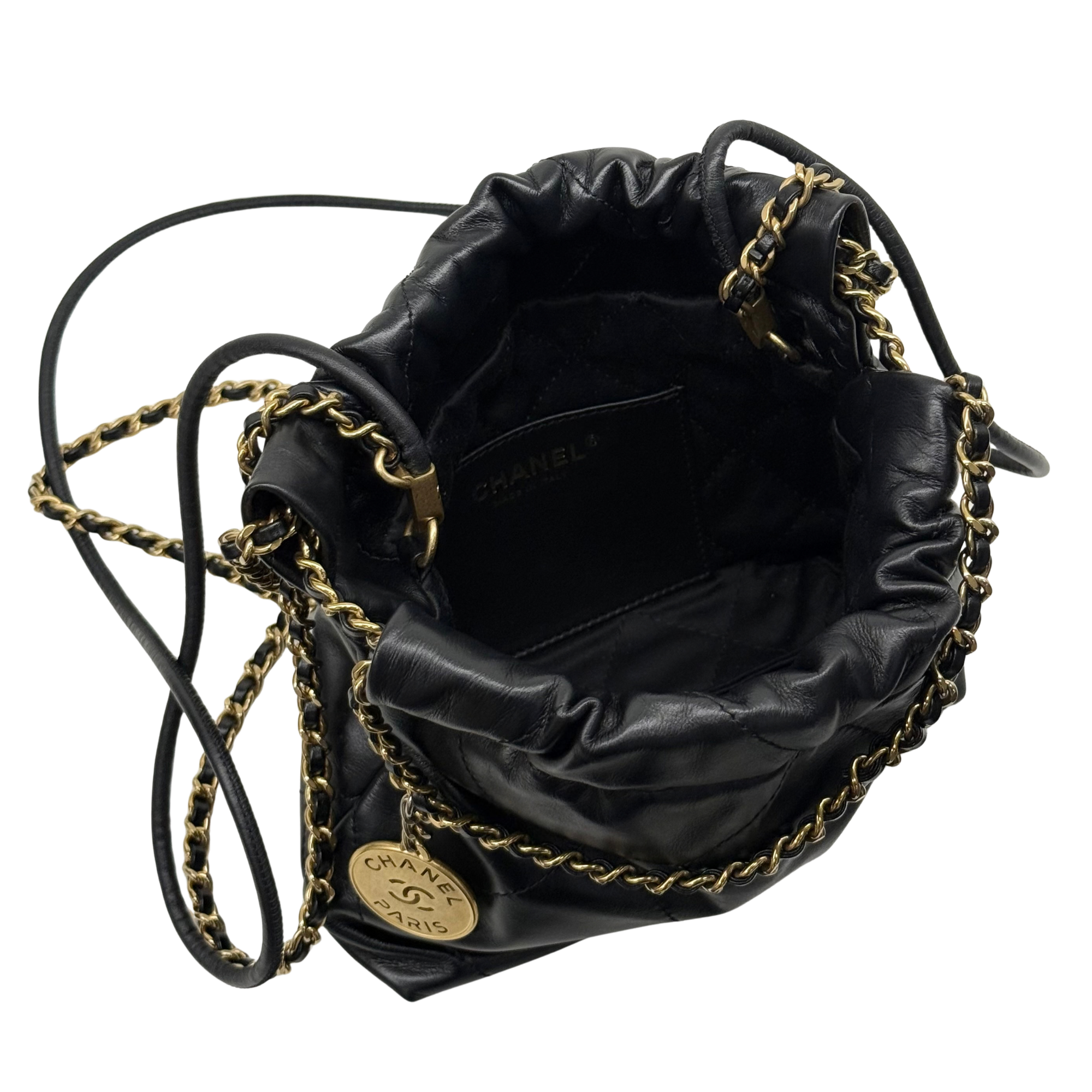 Black quilted mini hobo crossbody bag with gold chain strap and interior logo lining.