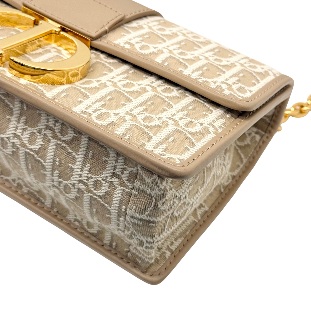 Dior pre-owned flap bag corner with gold latch and beige monogram canvas