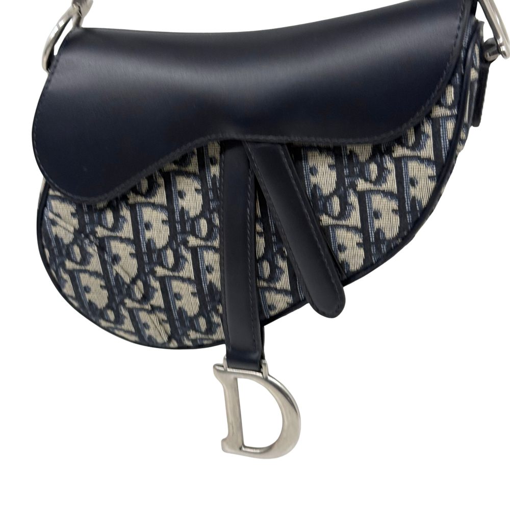 Pre-owned Dior saddle bag close view with black flap and navy monogram canvas front