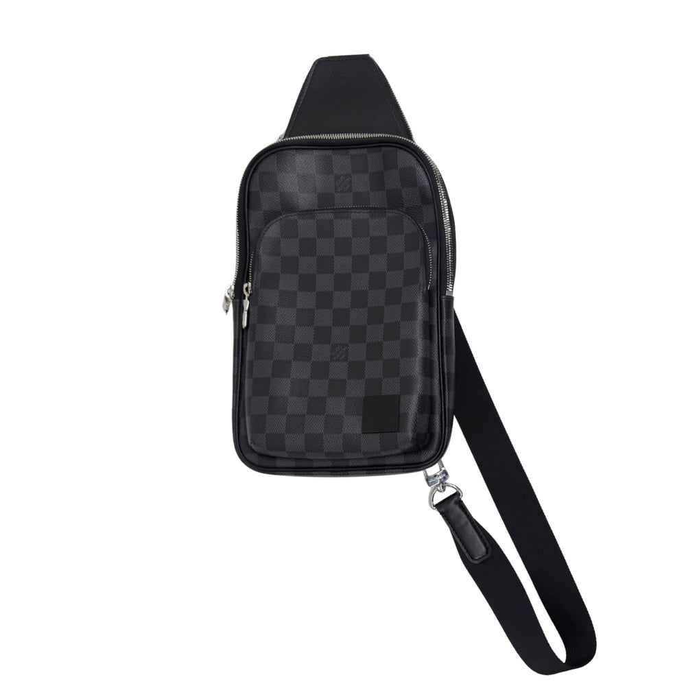 Dark checkered crossbody bag with front zip pocket and adjustable shoulder strap