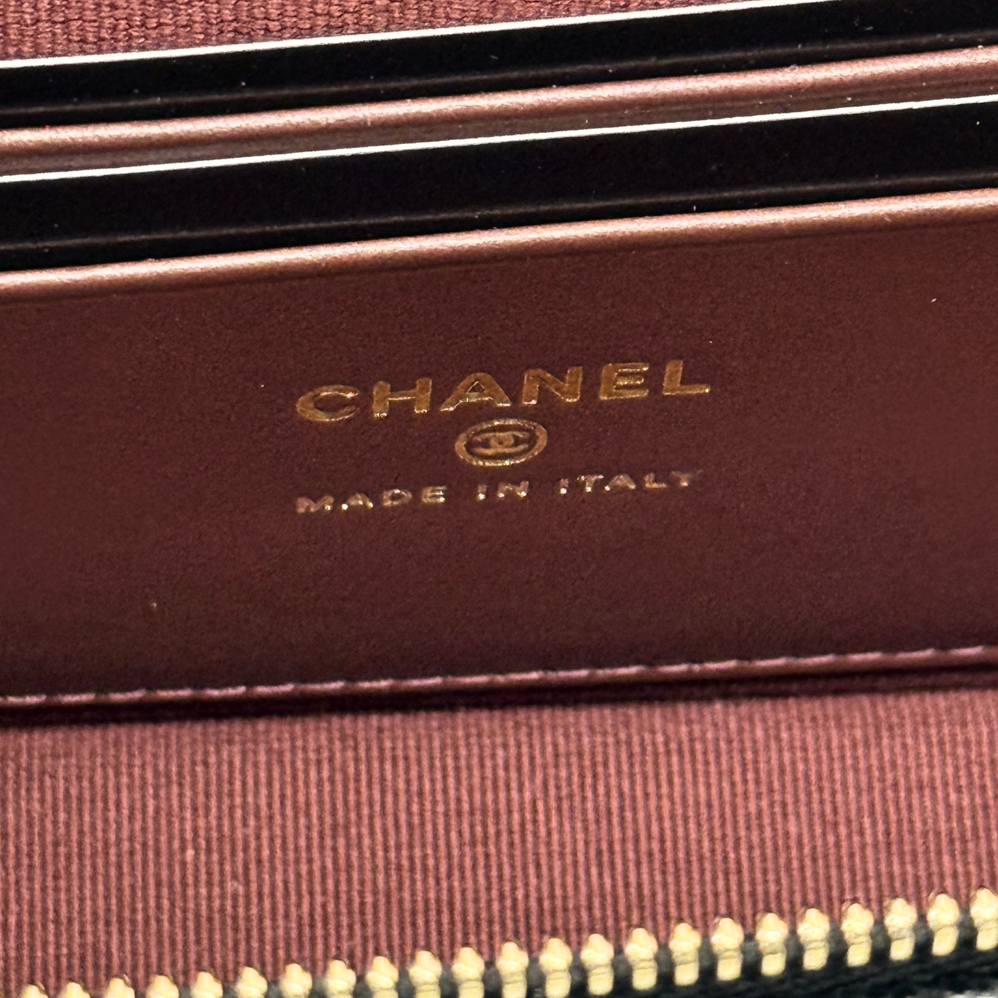 Chanel leather bag with gold "CHANEL" and "MADE IN ITALY" stamp