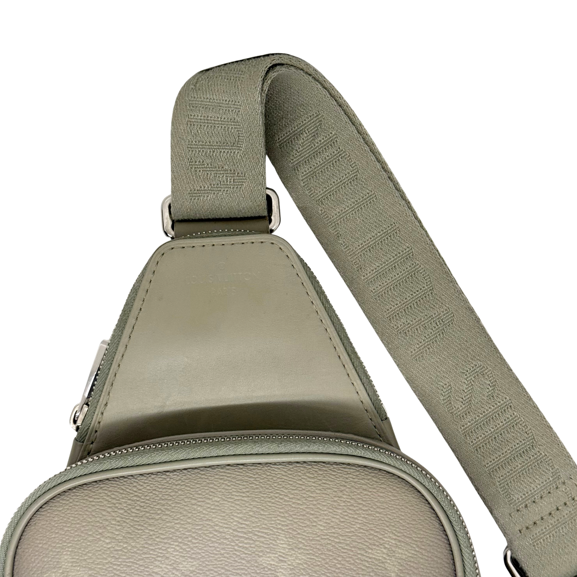 Louis Vuitton crossbody bag adjustable green strap with stitched pattern