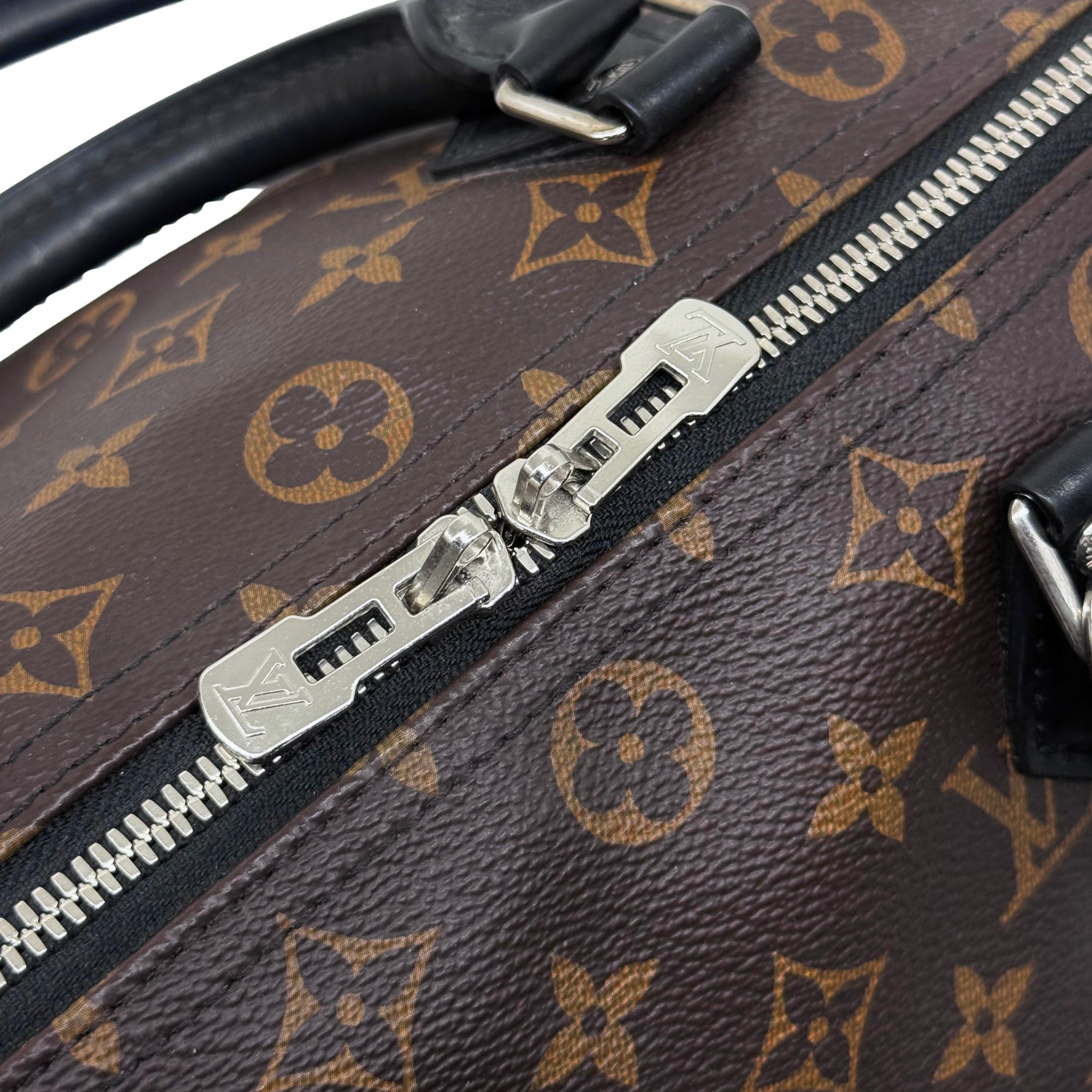 Louis Vuitton pre-owned monogram bag zipper with metal pull and black leather trim