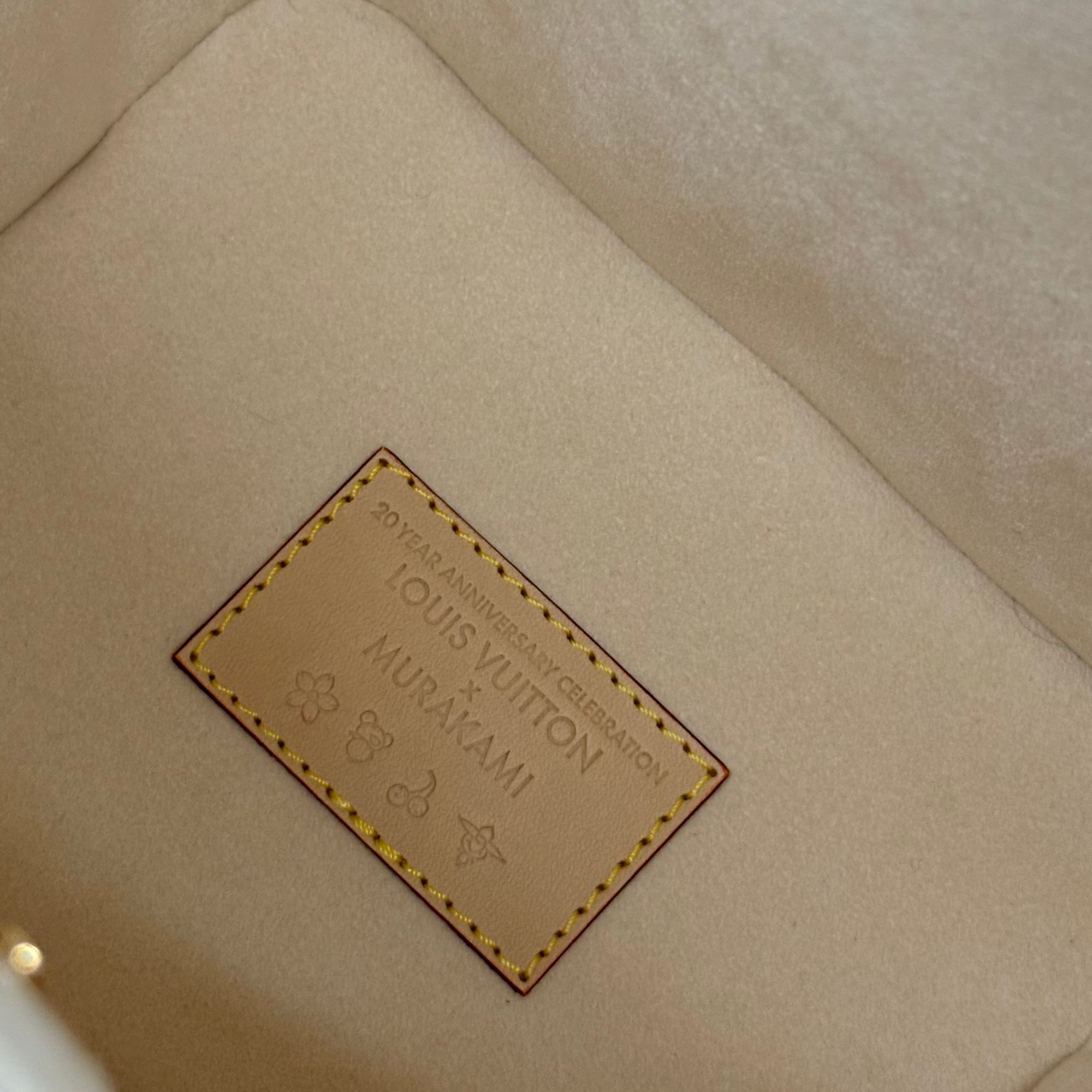 Louis Vuitton monogram gift tag on beige fabric lining, stitched edge