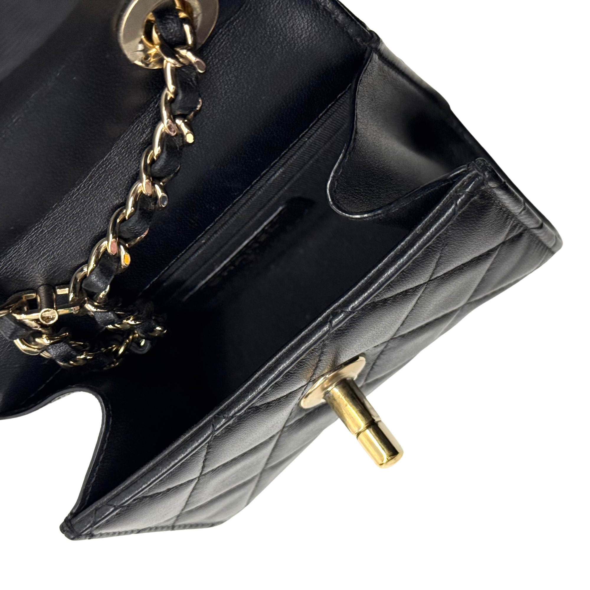Black Chanel quilted mini bag with chain and small turn-lock closure