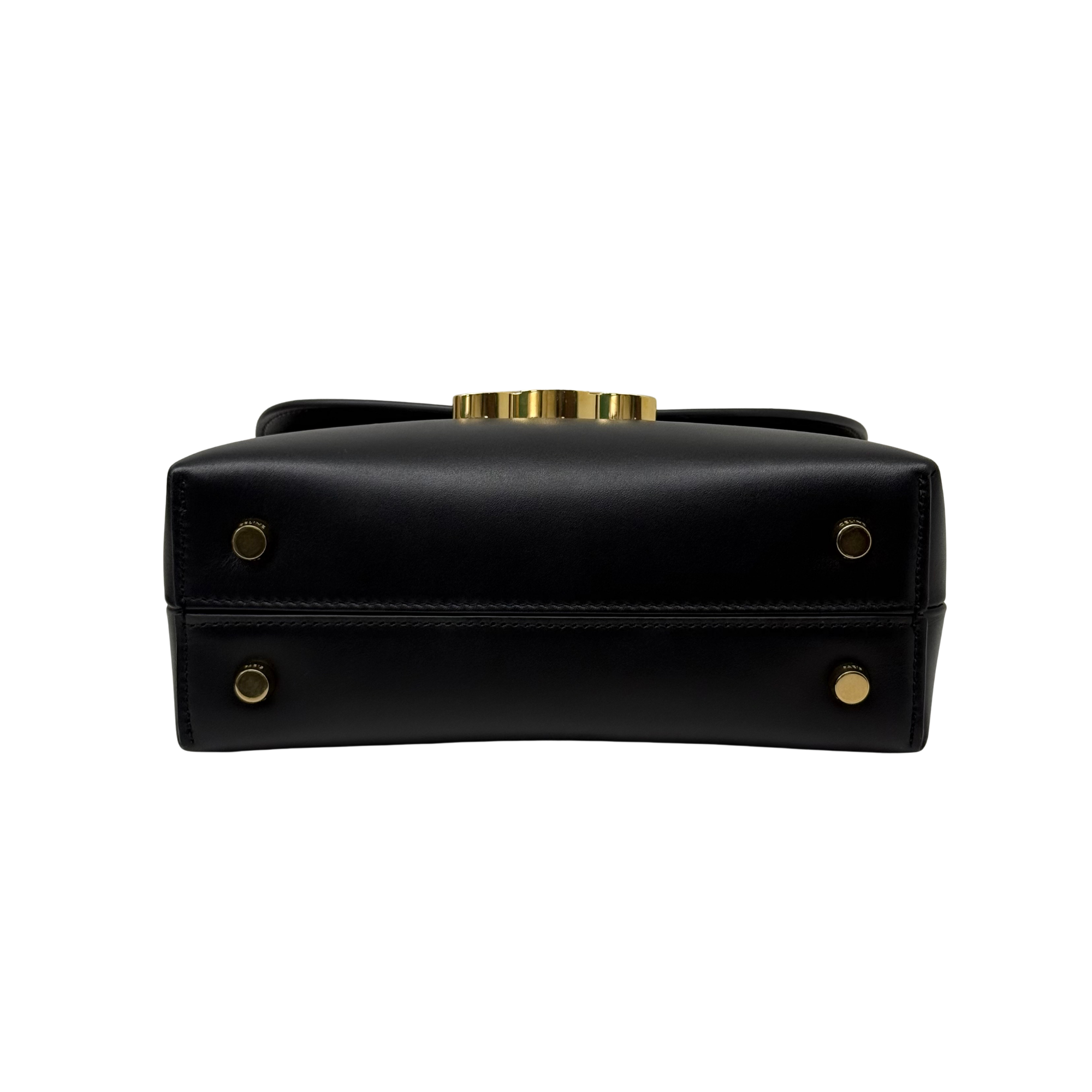 Black leather mini top-handle bag with gold hardware accents and front plaque