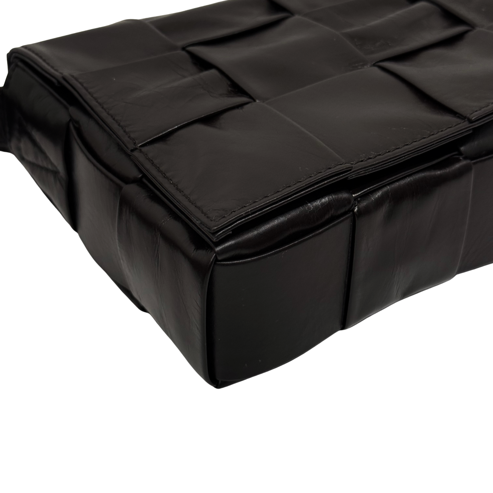 Quilted dark bag with stacked panel design and top flap detail