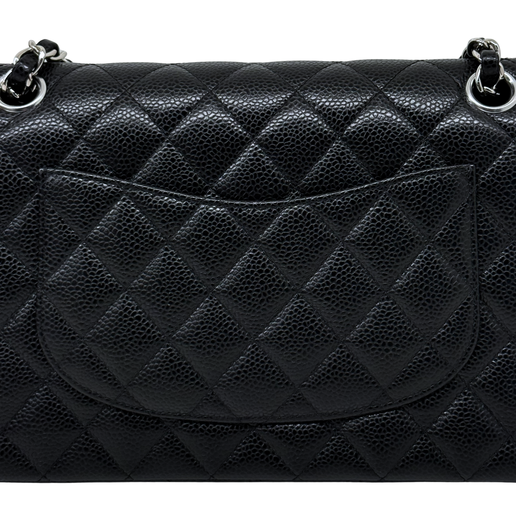 Quilted Chanel shoulder bag in dark textured leather with diamond pattern and curved flap