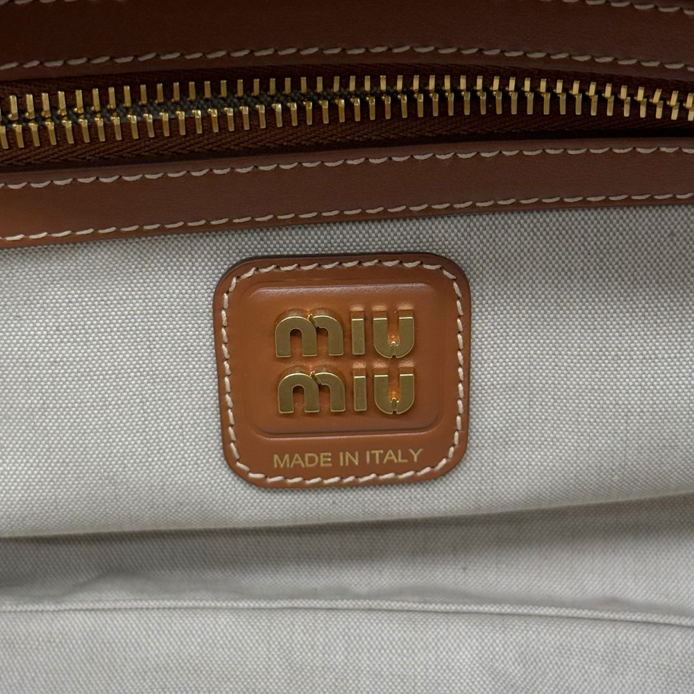 Miu Miu canvas bag leather logo patch with "Made in Italy"