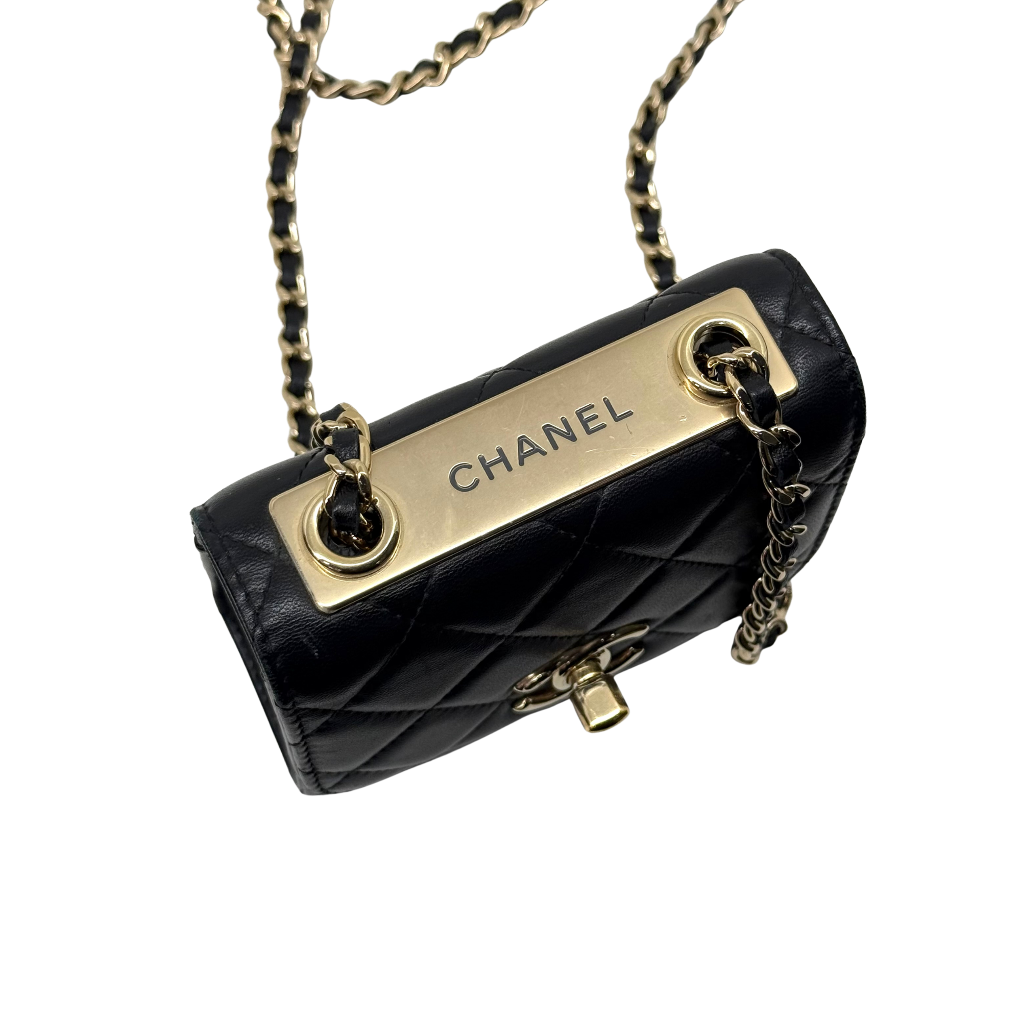 Black Chanel quilted mini flap bag with gold bar clasp, CC emblem and chain