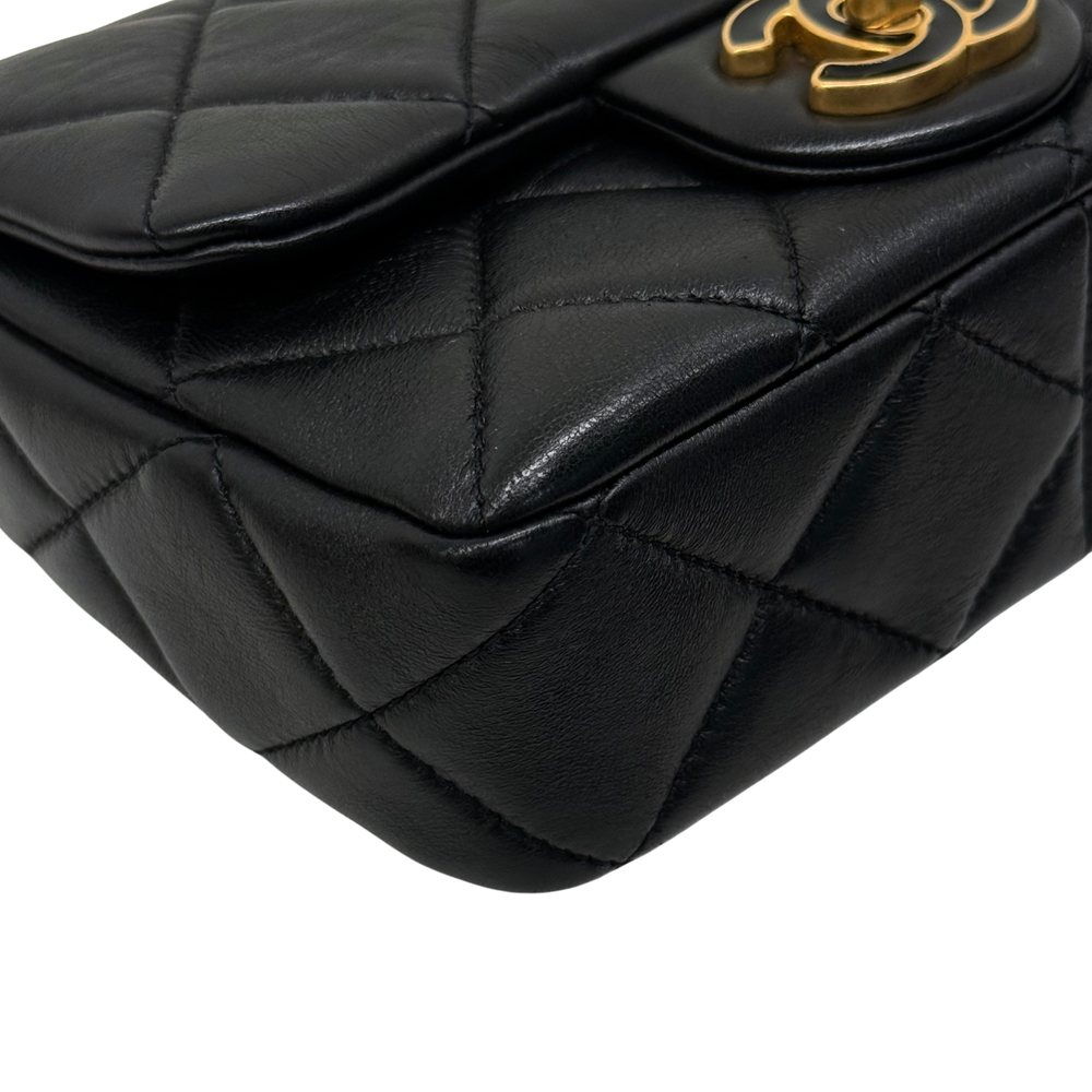 Black quilted leather shoulder bag with gold-tone flap turn-lock hardware