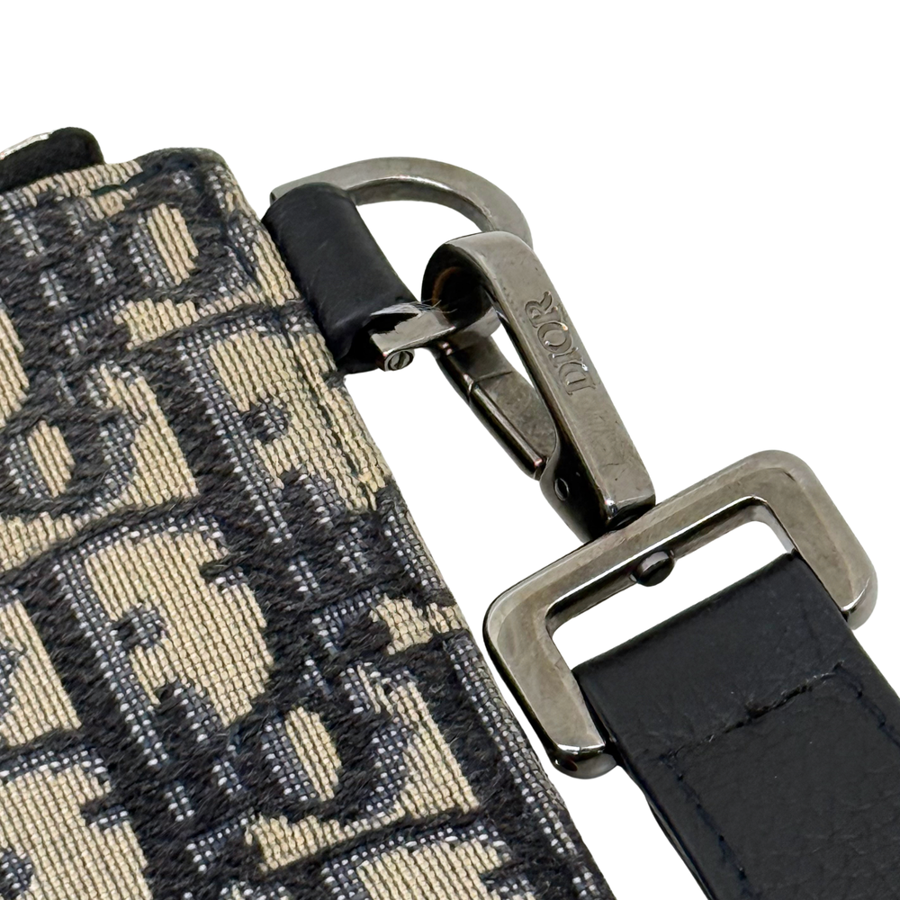 Dior pre-owned wrist strap and metal rings with zipper on patterned canvas pouch