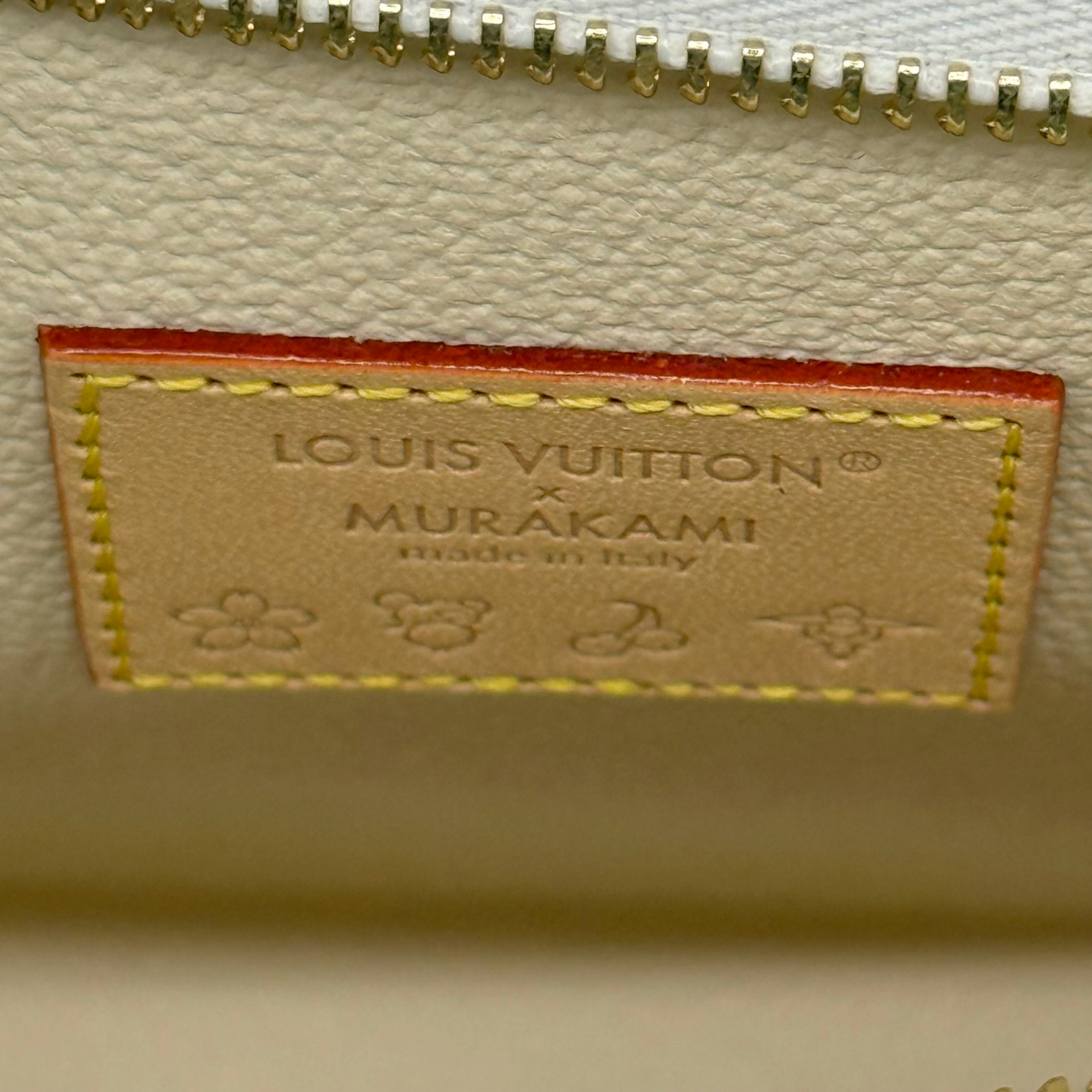 Louis Vuitton pouch interior label, beige leather patch with gold branding and stitching