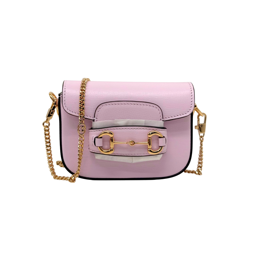 Pink Gucci mini crossbody bag front view with gold-tone buckles and chain straps