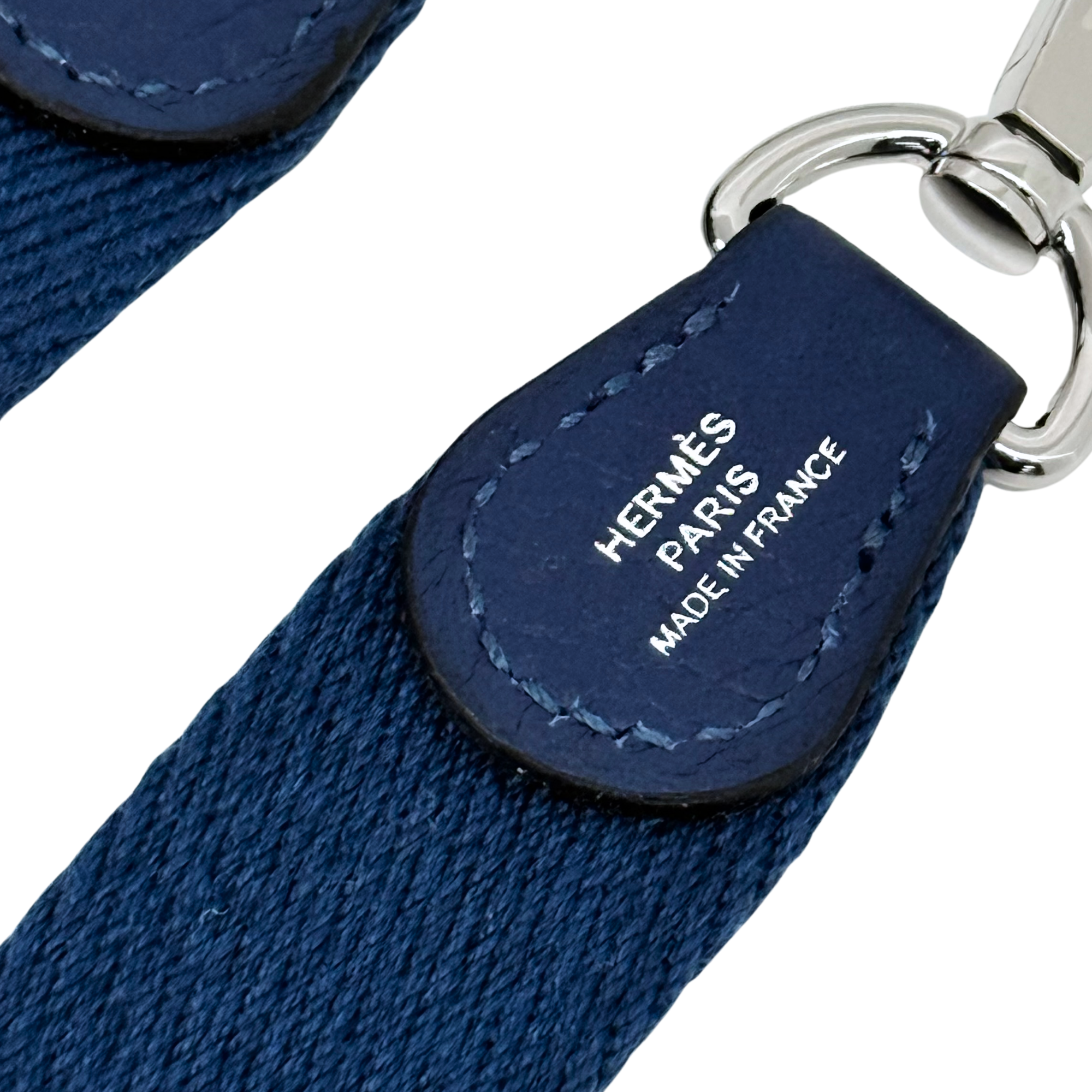 Navy leather strap end with Hermes Paris France text and stitched leather tab