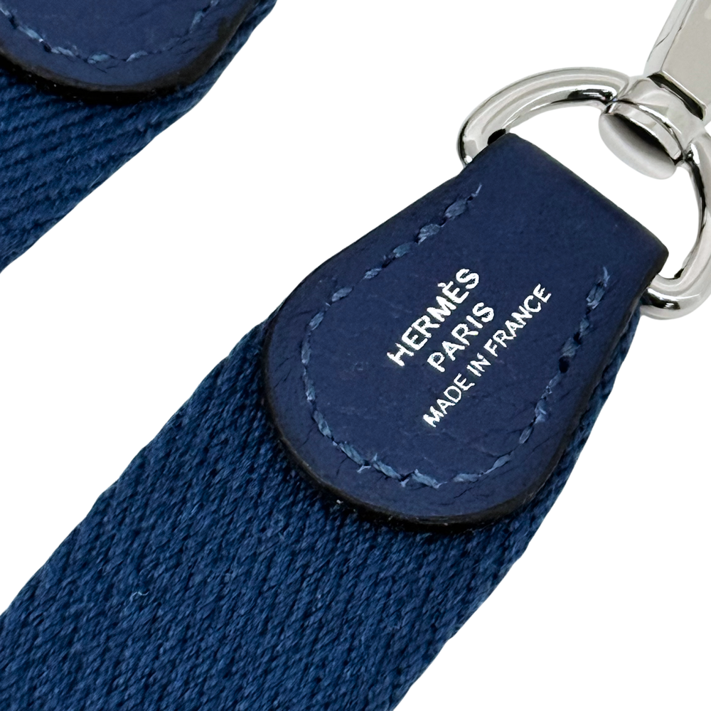 Navy leather strap end with Hermes Paris France text and stitched leather tab