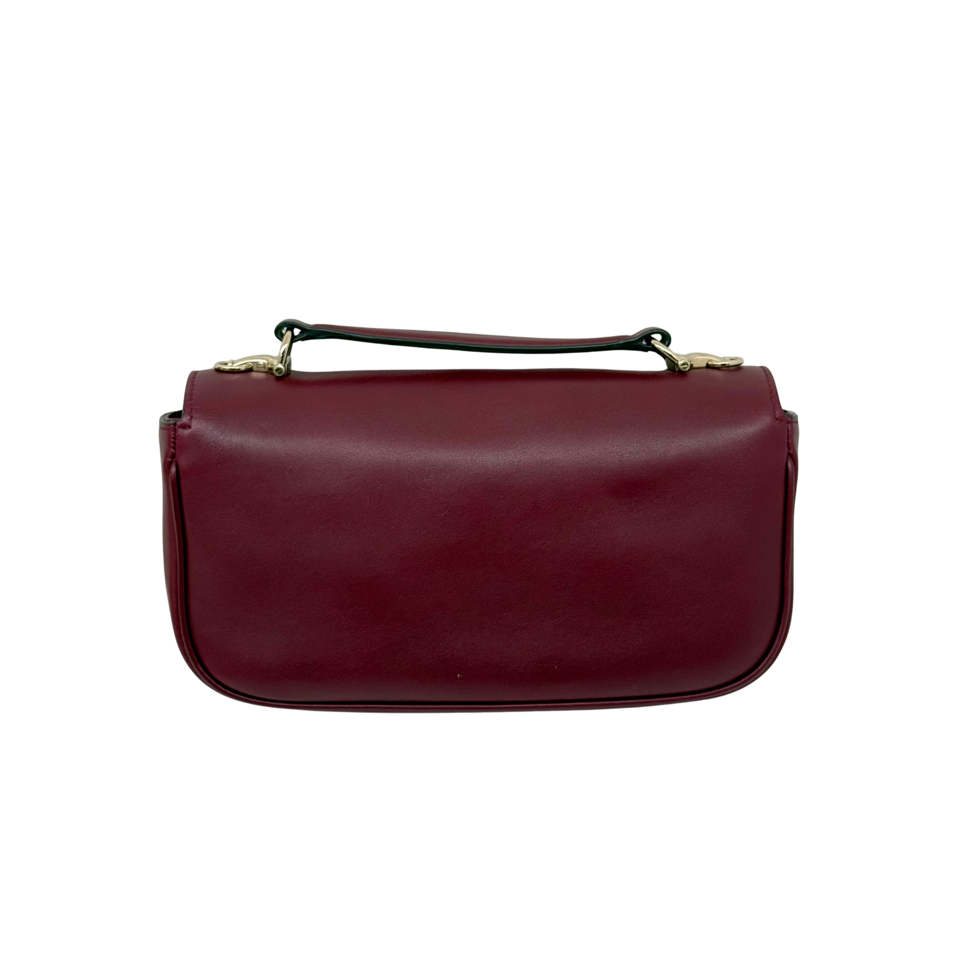 Maroon leather mini bag with top handle and smooth front panel