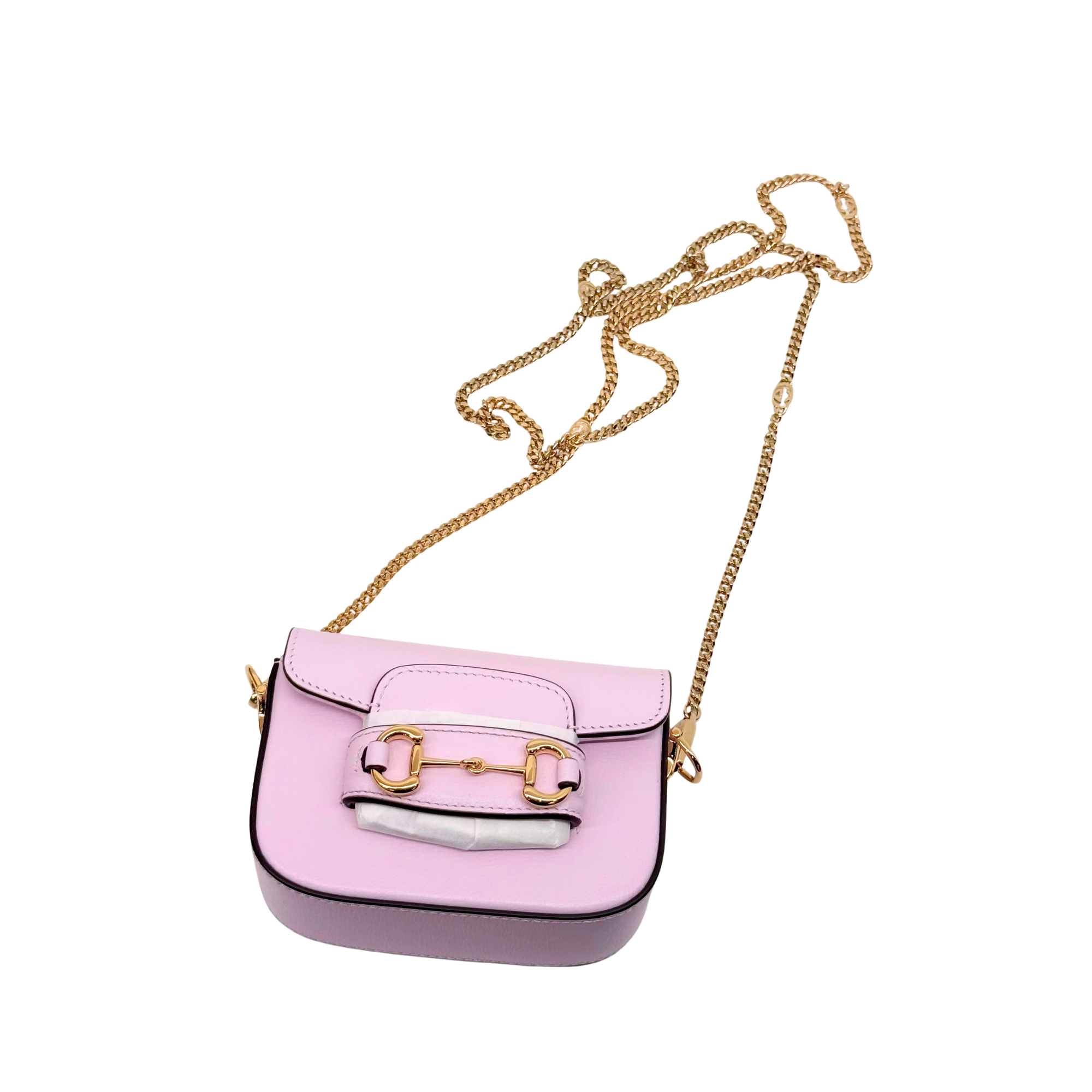 Pink Gucci mini crossbody bag with gold chain strap and rectangular flap
