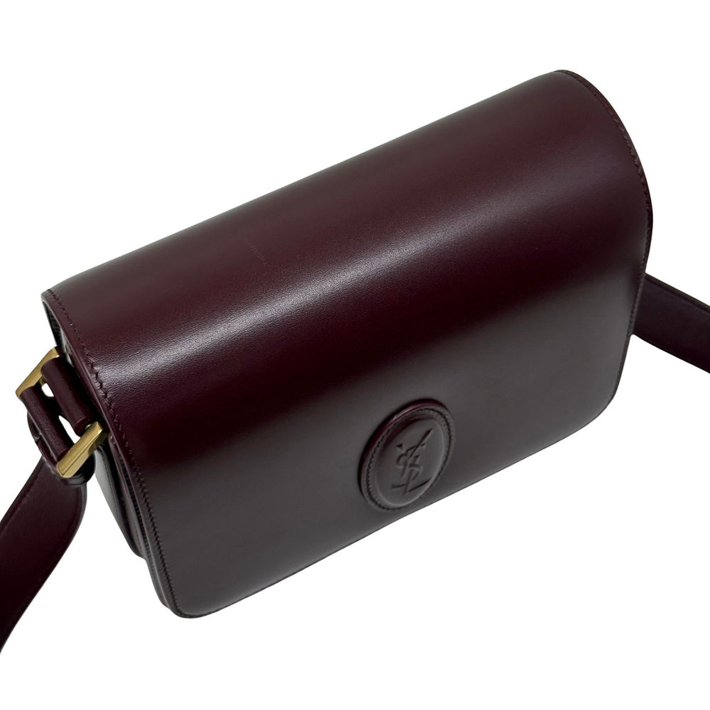 Saint Laurent Le 61 Besace bag back view with embossed YSL logo on burgundy leather