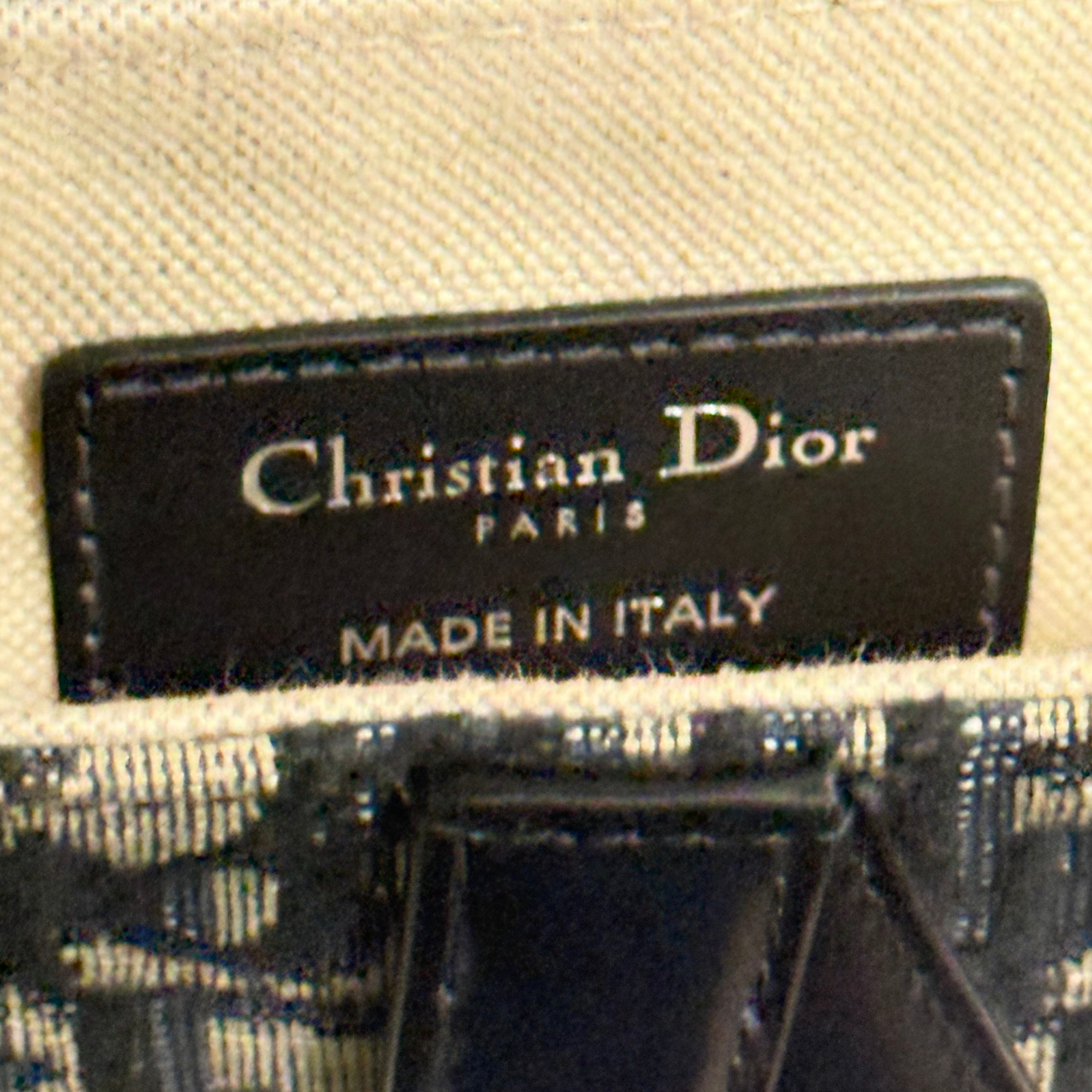 Pre-owned Dior leather label patch, black with gold “Christian Dior” text and “Made in Italy”