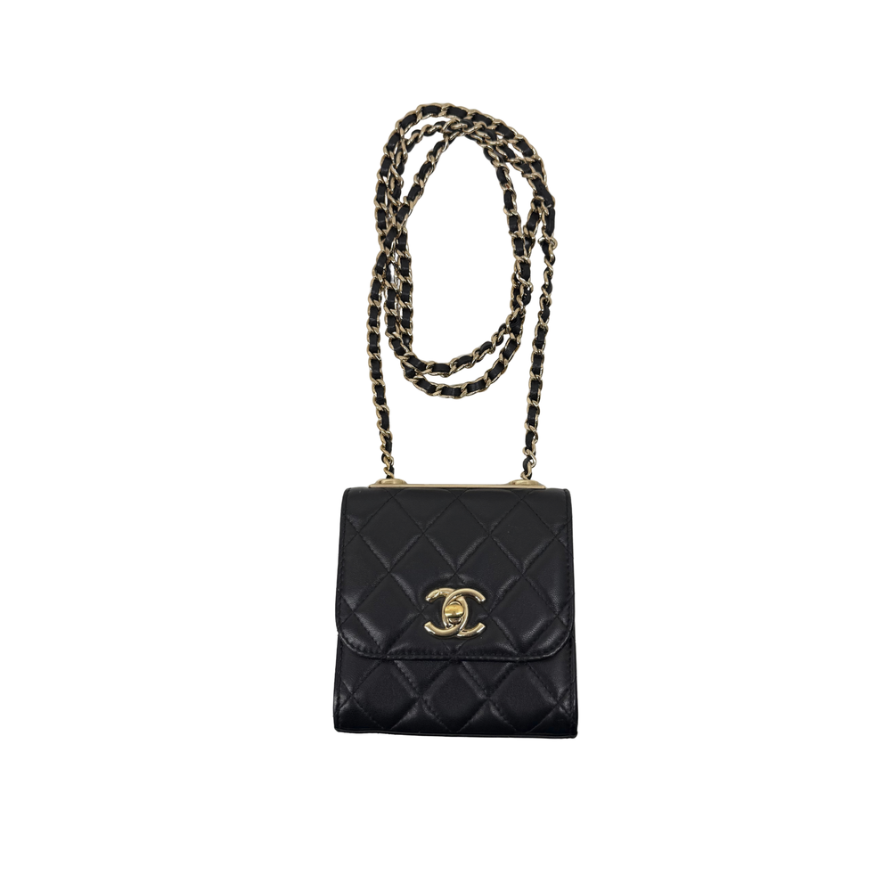 Black Chanel quilted mini flap bag with gold CC emblem and braided chain strap