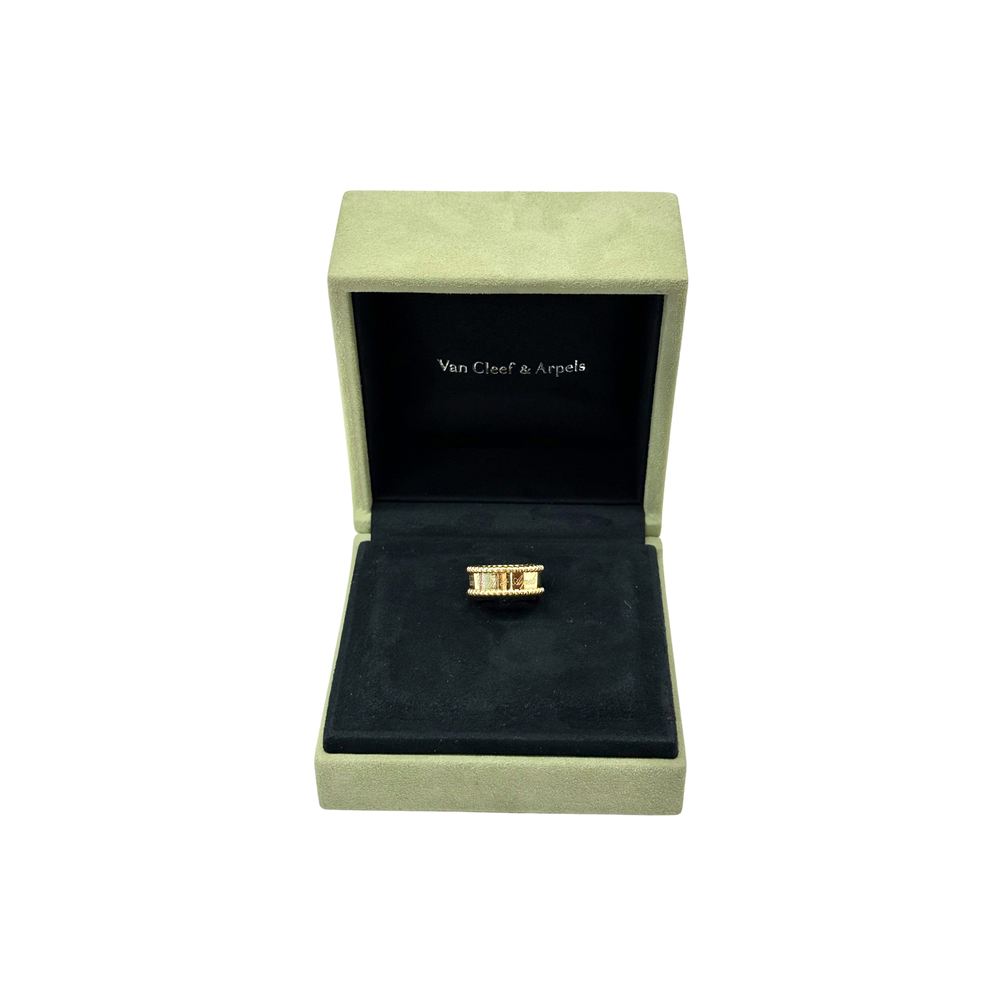 Gold-tone Van Cleef & Arpels ring displayed in presentation box