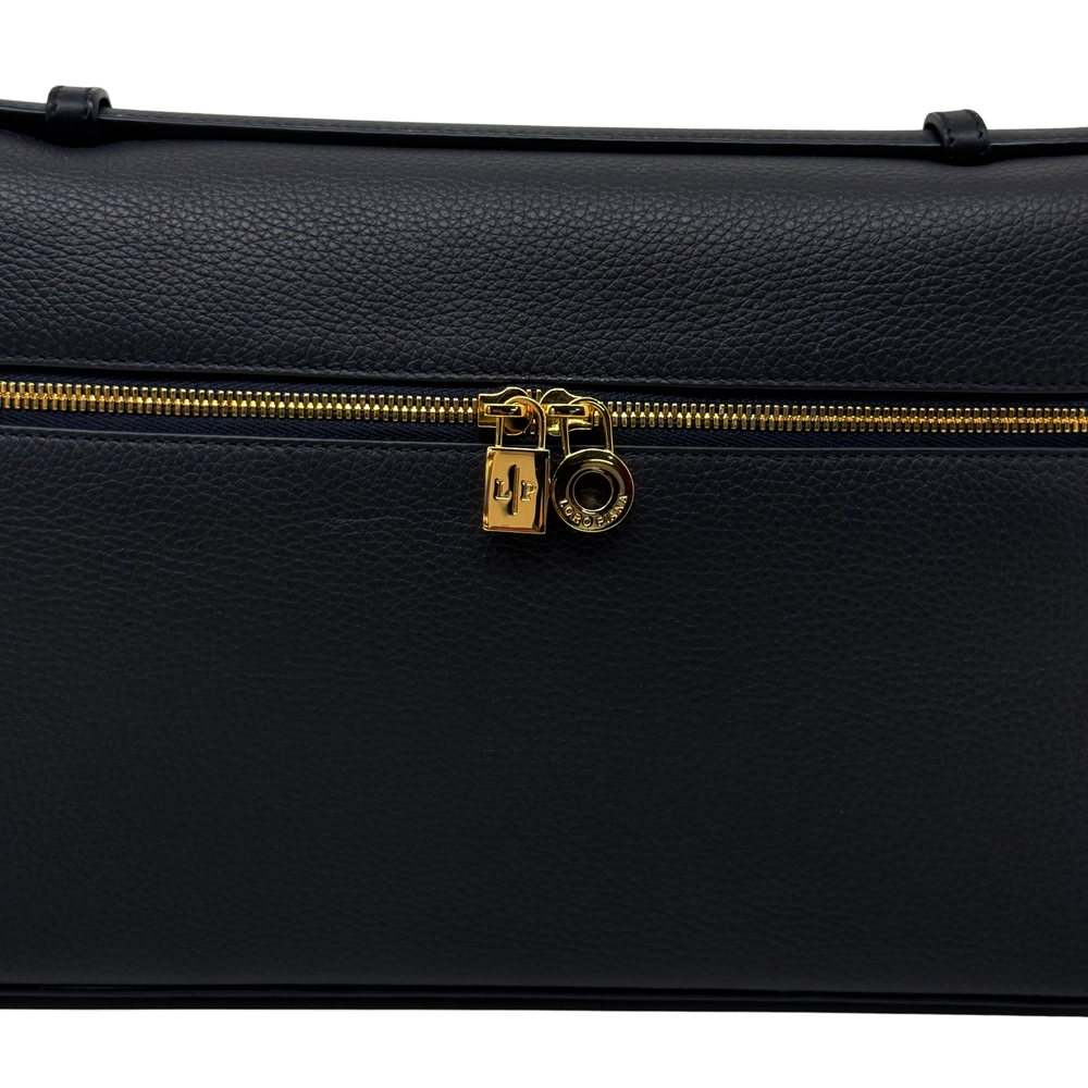 Loro Piana leather zip pouch close-up with gold lock