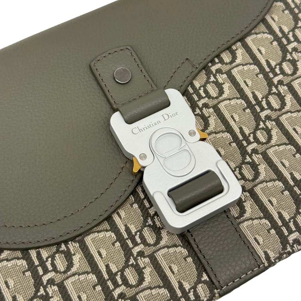 Dior CD-style hardware on olive leather flap over beige monogram fabric