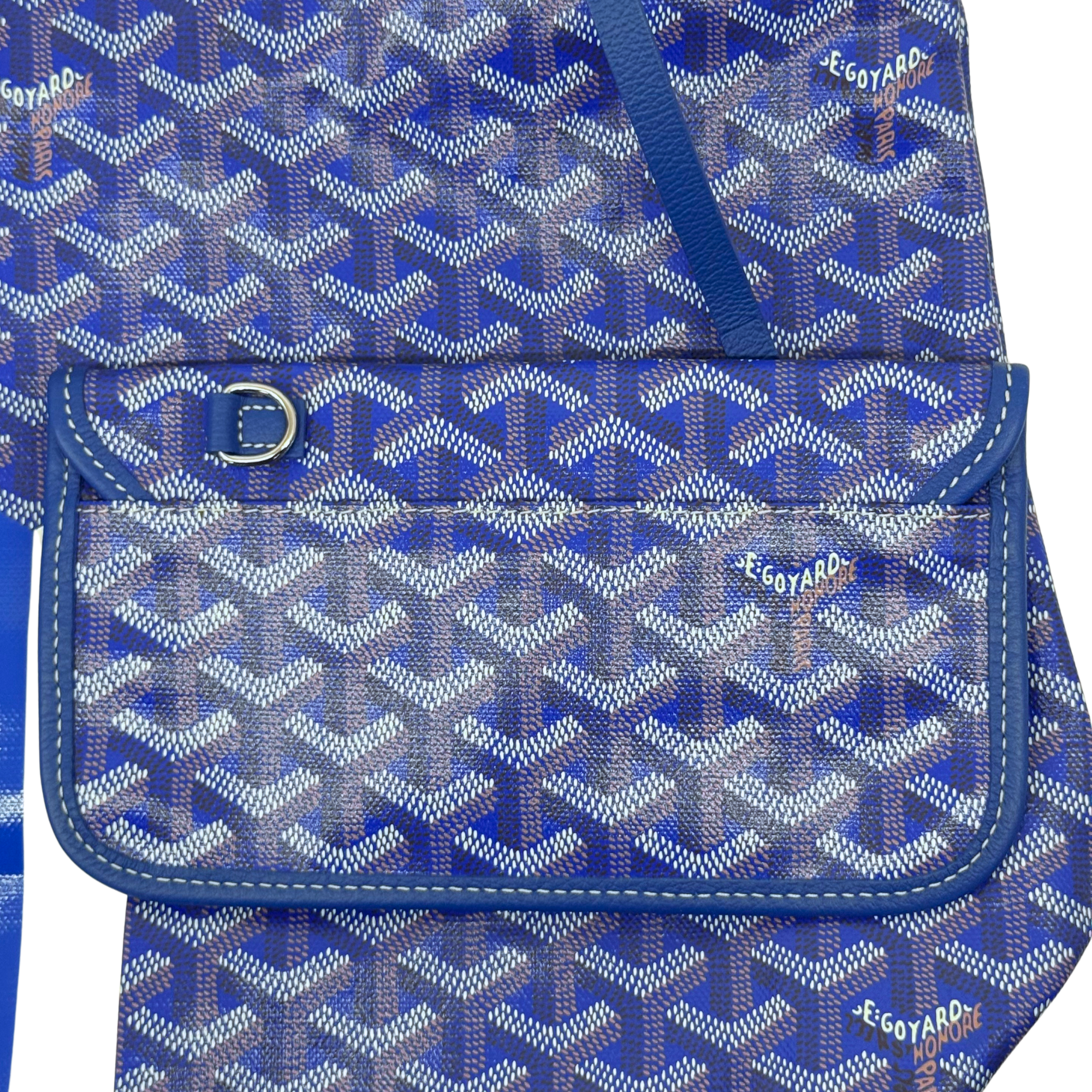 Blue patterned handbag front pocket with snap strap and stitched flap